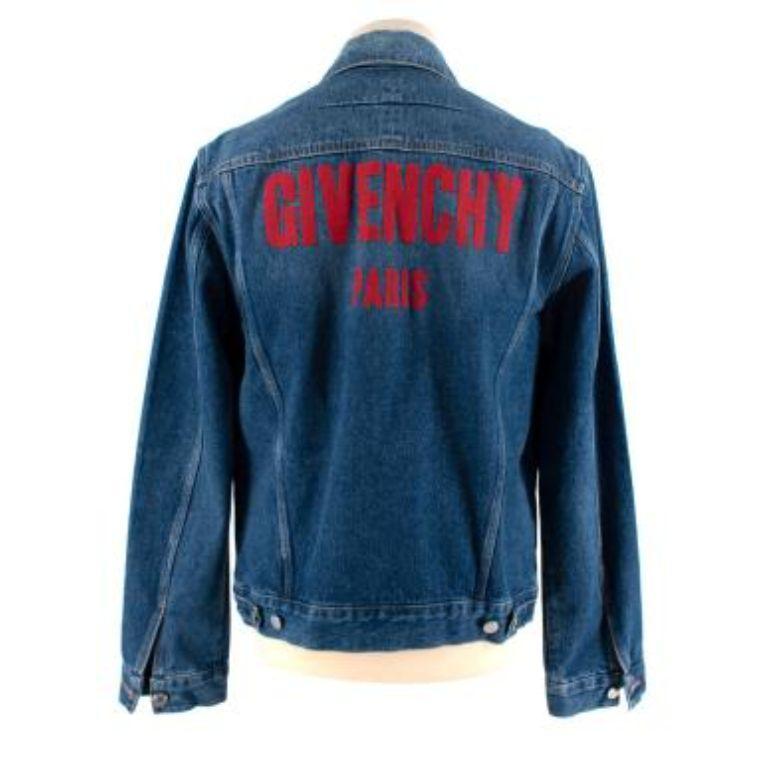 Givenchy Mid-Wash Blue Denim Logo Printed Jacket
 

 - Mid-weight denim jacket with a large red logo across the back of the shoulder 
 - Classic collar
 - Button down
 - Long sleeve
 - Classic fit
 - Unlined 
 

 Materials:
 Shell: 
 100% Cotton 
