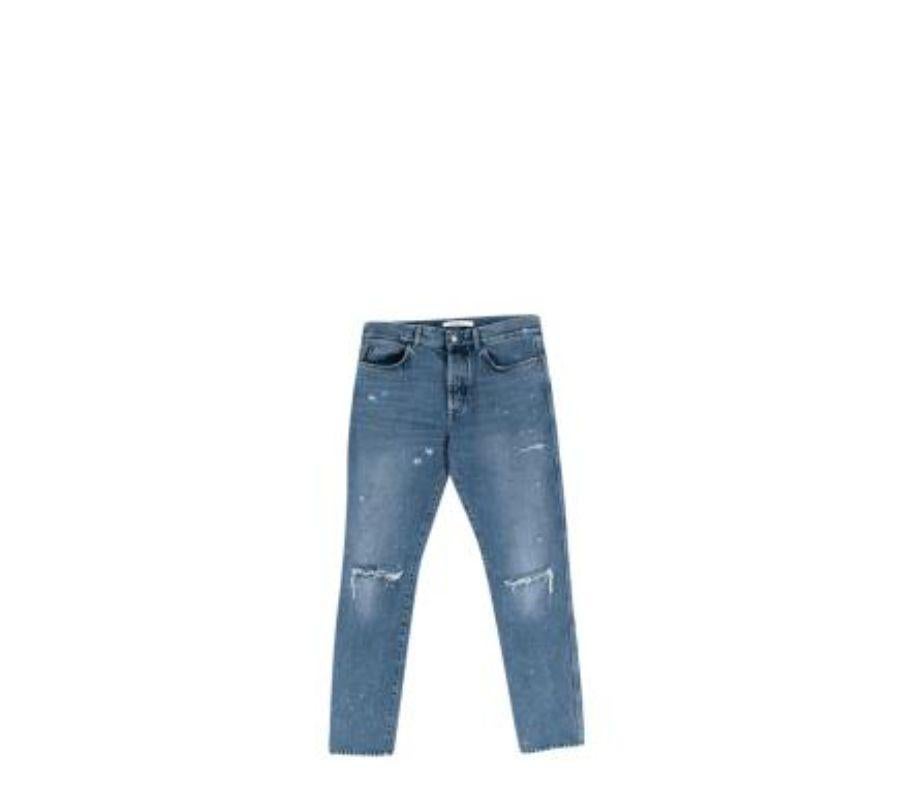 Givenchy Mid-Wash Distressed Denim Skinny Jeans
 

 - Mid wash blue denim with faded front and ripped knees
 - Lightning bolt embroidered back pocket 
 - 5 pocket cut, button fly
 

 Materials: 
 100% Cotton
 

 Made in Romania
 Machine wash at 30