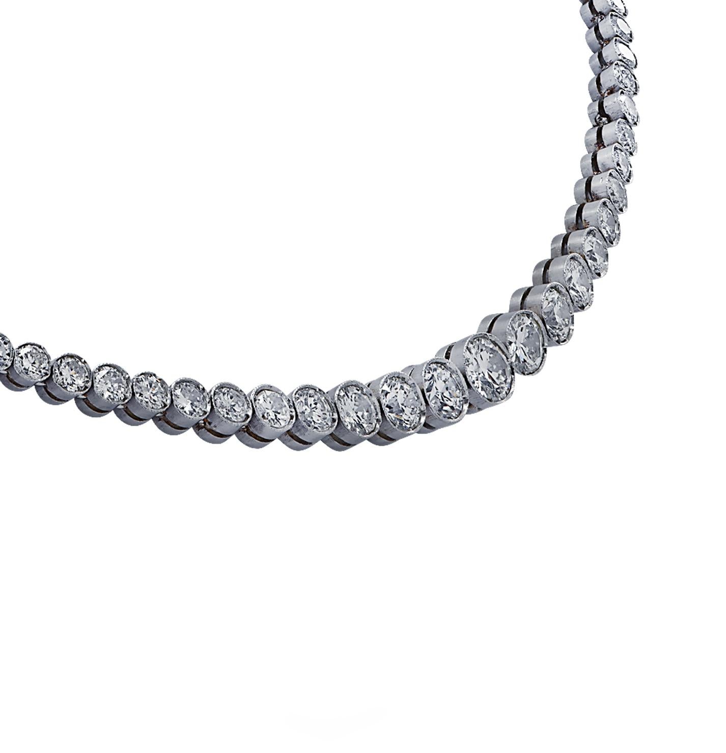Exquisite diamond riviere necklace Circa 1940 crafted in platinum, showcasing approximately 10 carats of old European cut & transitional cut Diamonds, G - H color, VS-SI Clarity. The graduating diamonds are set in a seamless sea of eternity,