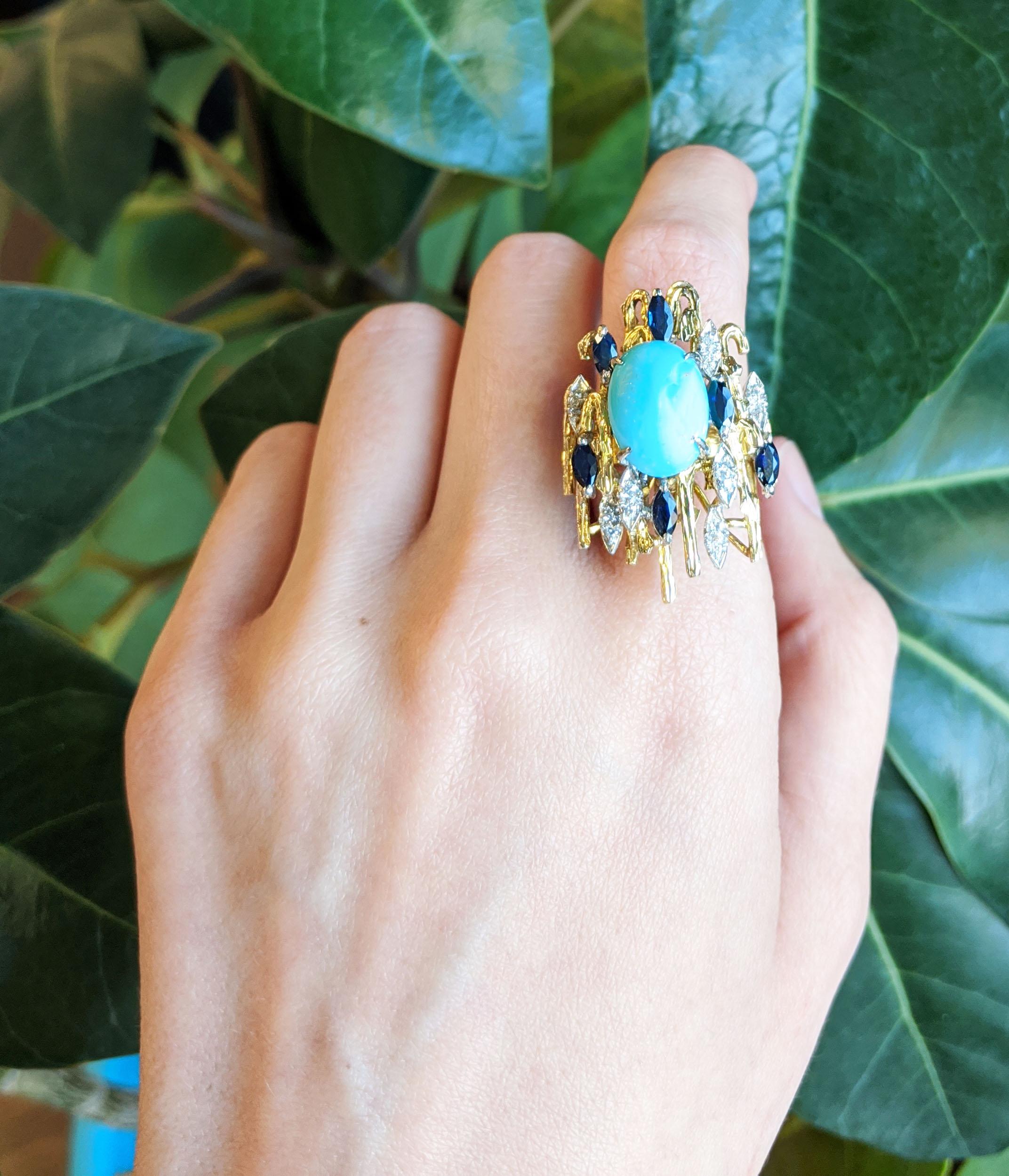 With its stunning Persian turquoise center, diamond and sapphire accents, and bold, architectural design, this 18k two-tone gold mid-century statement ring is unlike anything you will see! The architectural design is reminiscent of Frank Lloyd