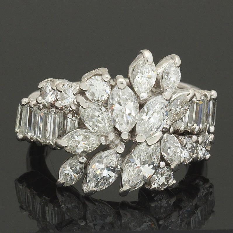This is a gorgeous huge fiery diamond ring set in 14k white gold with a beautiful array of marquise cuts, emerald baguettes, and round brilliant cut diamonds.  The total estimated diamond weight 3.00 carats with G/H color and VS2-SI1 clarity.

The