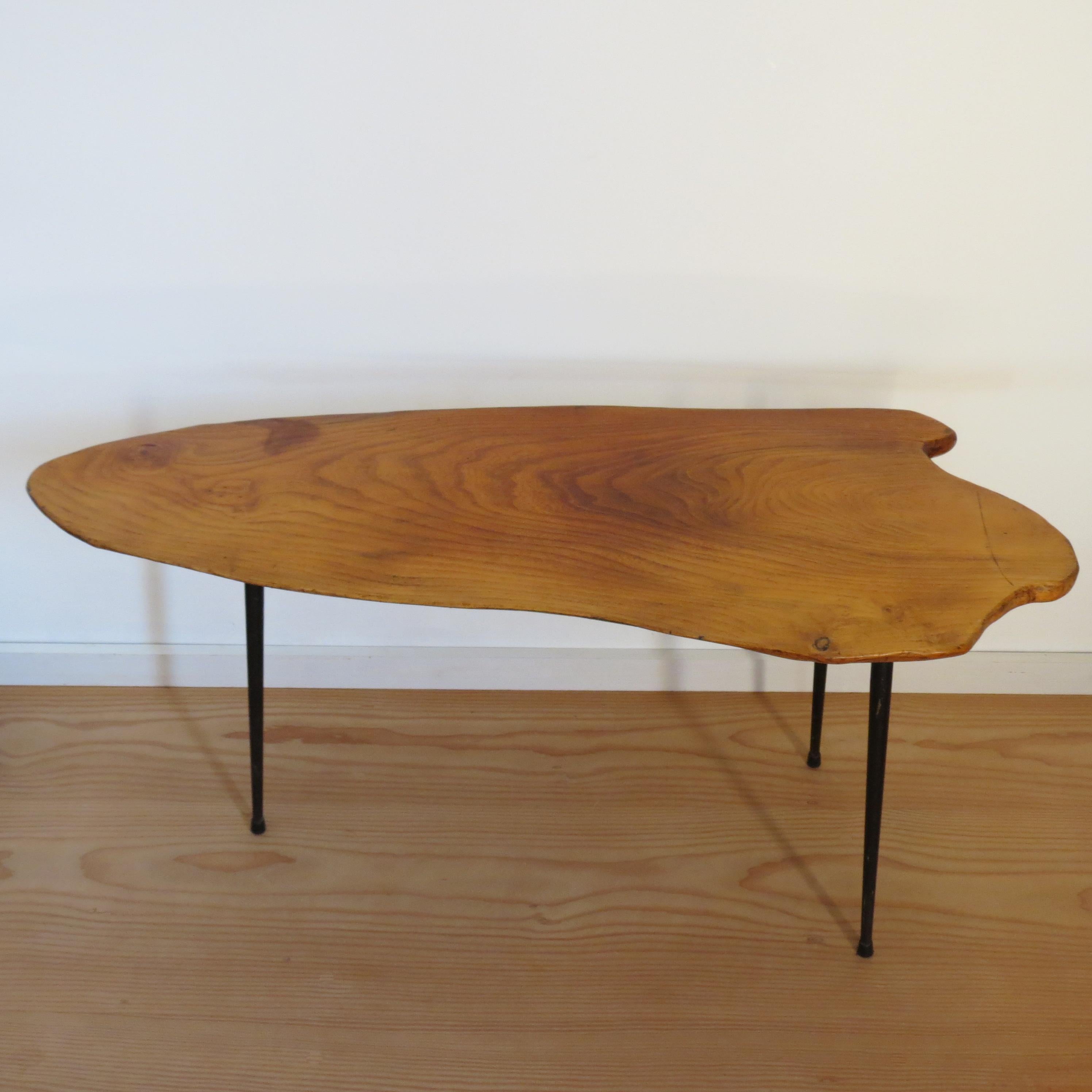 Wonderful waney edge coffee table in the style of Carl Aubock, Austria. 
Metal legs supporting a waney live edge top made from solid Elm.  Very elegant design. In good vintage condition, signs of use to the top. 

ST1635
43cm x 99cm x 44cm tall 