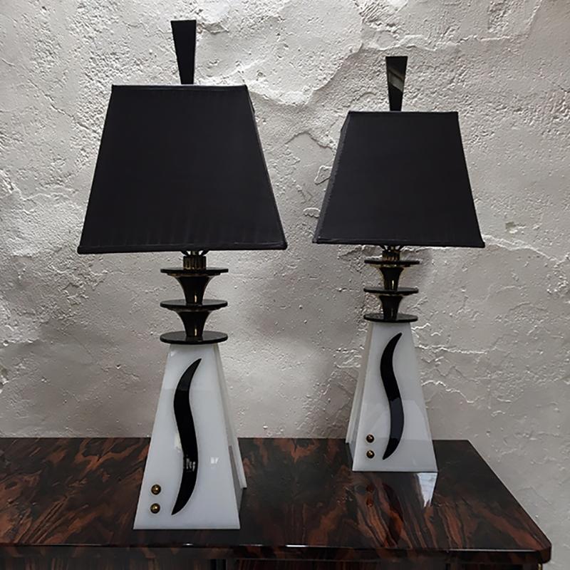 Spectacular large pair of 1950s Midcentury lamps in the American Modernist style by Moss Lighting Co, San Francisco.
Black and white acrylic / Lucite with brass detail, with handmade silk shades in black and gold with top diffuser - complete with
