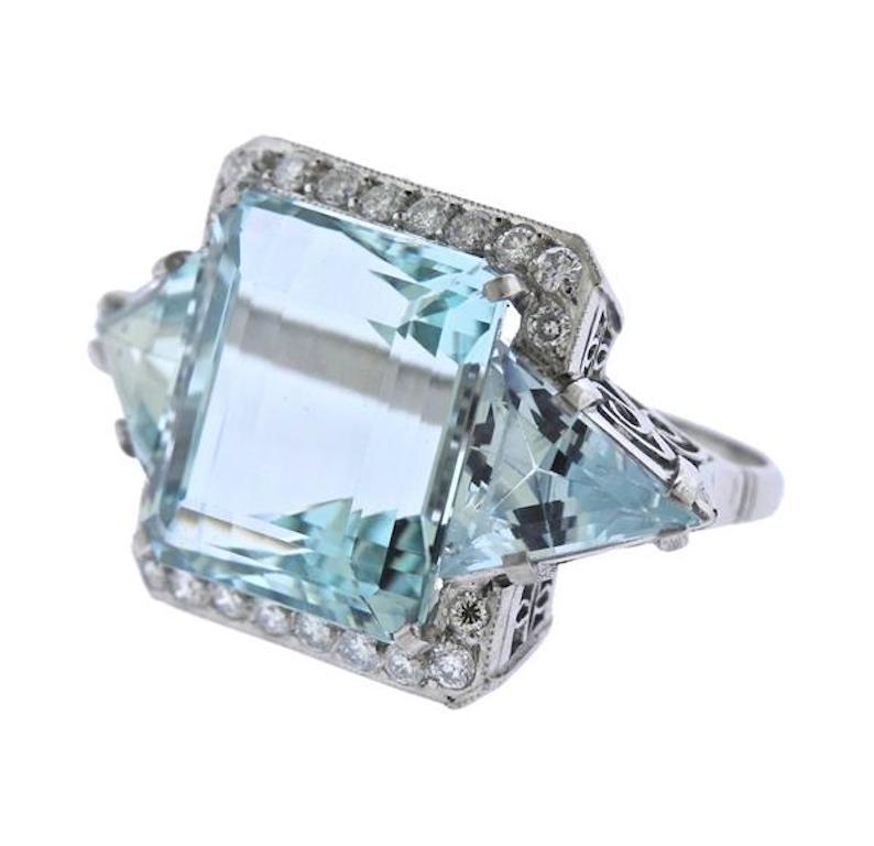 This amazing impressive ring is set in solid platinum, tested, and features a huge central 25 carat VVS clarity emerald cut aquamarine.  The side aquamarines are also of the finest quality, each approximately 2.5-3 carats with approximately 0.85