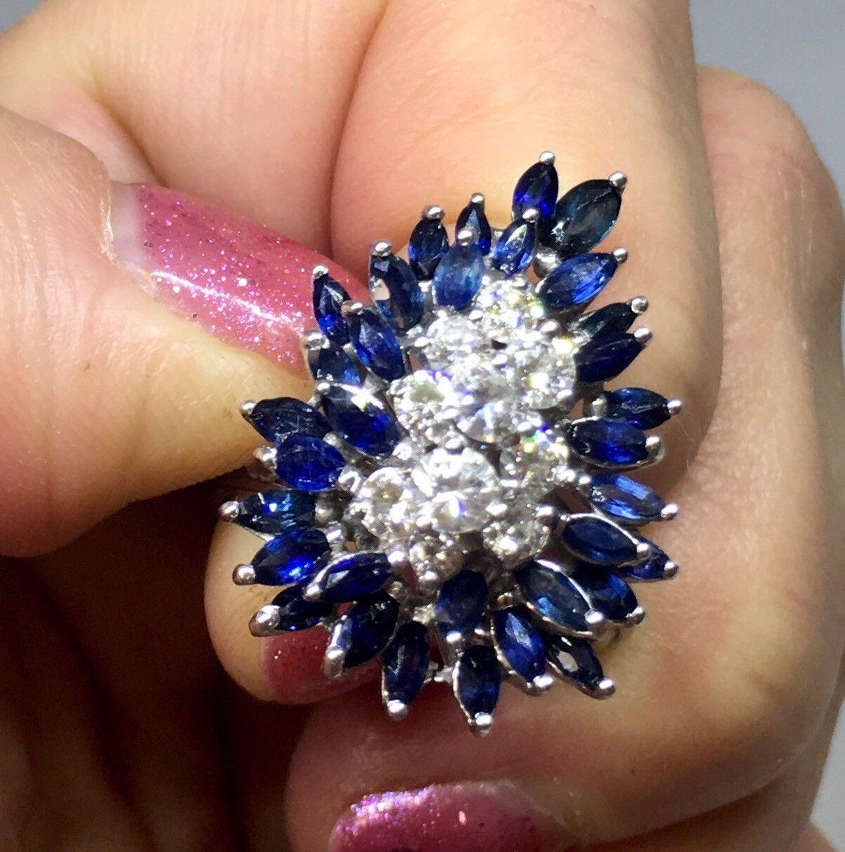 Stunning 1950s G/VS1 2.48 Sapphire Diamond Spray Cluster Cocktail Statement Ring

Stylish 1950s 14k white gold sapphire and diamond statement ring is set with an impressive array of marquise cut natural blue sapphires, with a total estimated