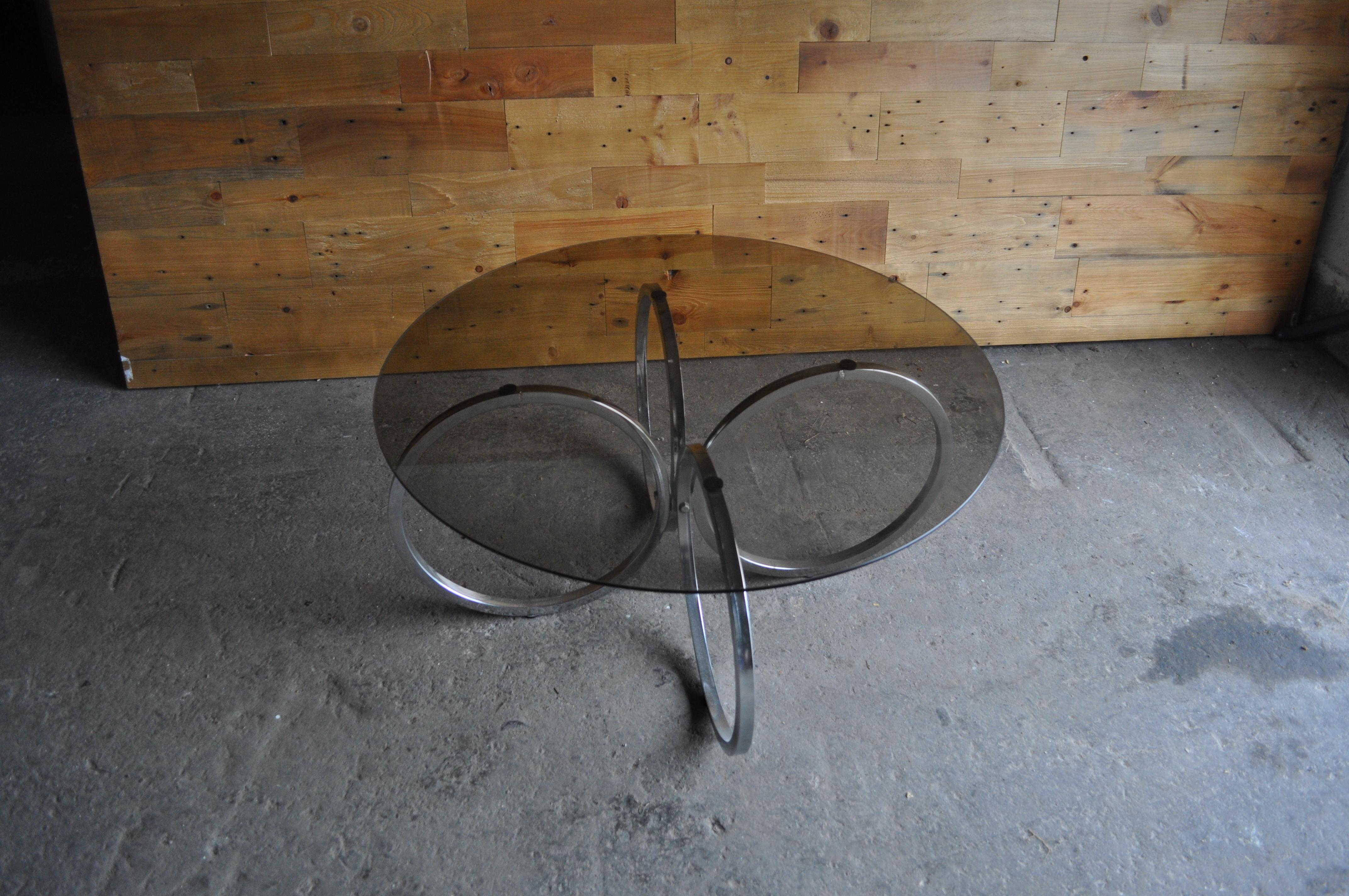 Stylish round smokey grey glass top coffee table with tubular chrome legs 
Good condition 
Beautiful table 
The glass has minor scratches.
 