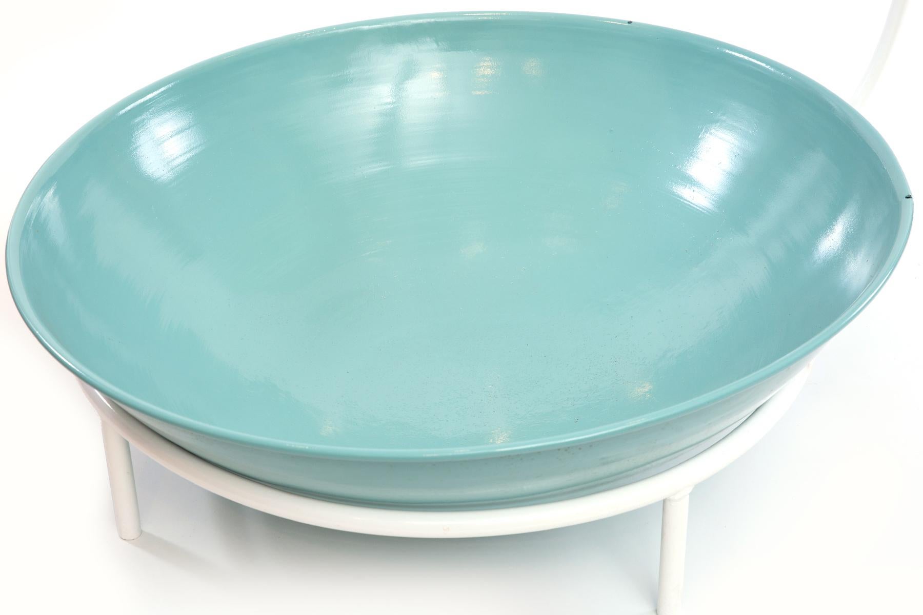 This whimsical fountain in powder-coated steel features three tiers, each with a pastel colored basin in graduated size.
