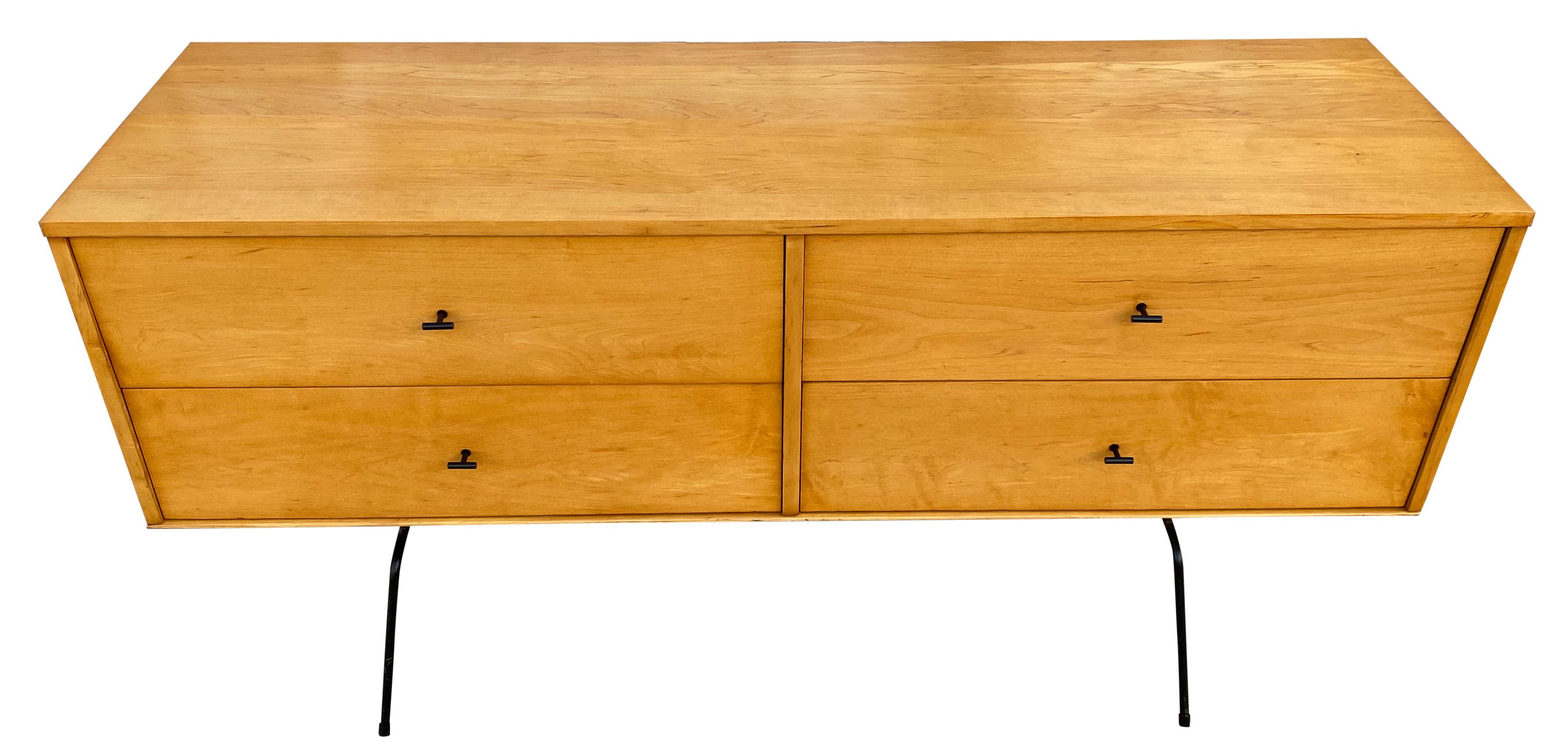 Rare midcentury low dresser credenza by Paul McCobb circa 1950 Planner Group #1504 with 4 low drawers - solid maple construction has a raw blonde maple lacquered finish. All original Black Steel T Pulls. Sits on a 60