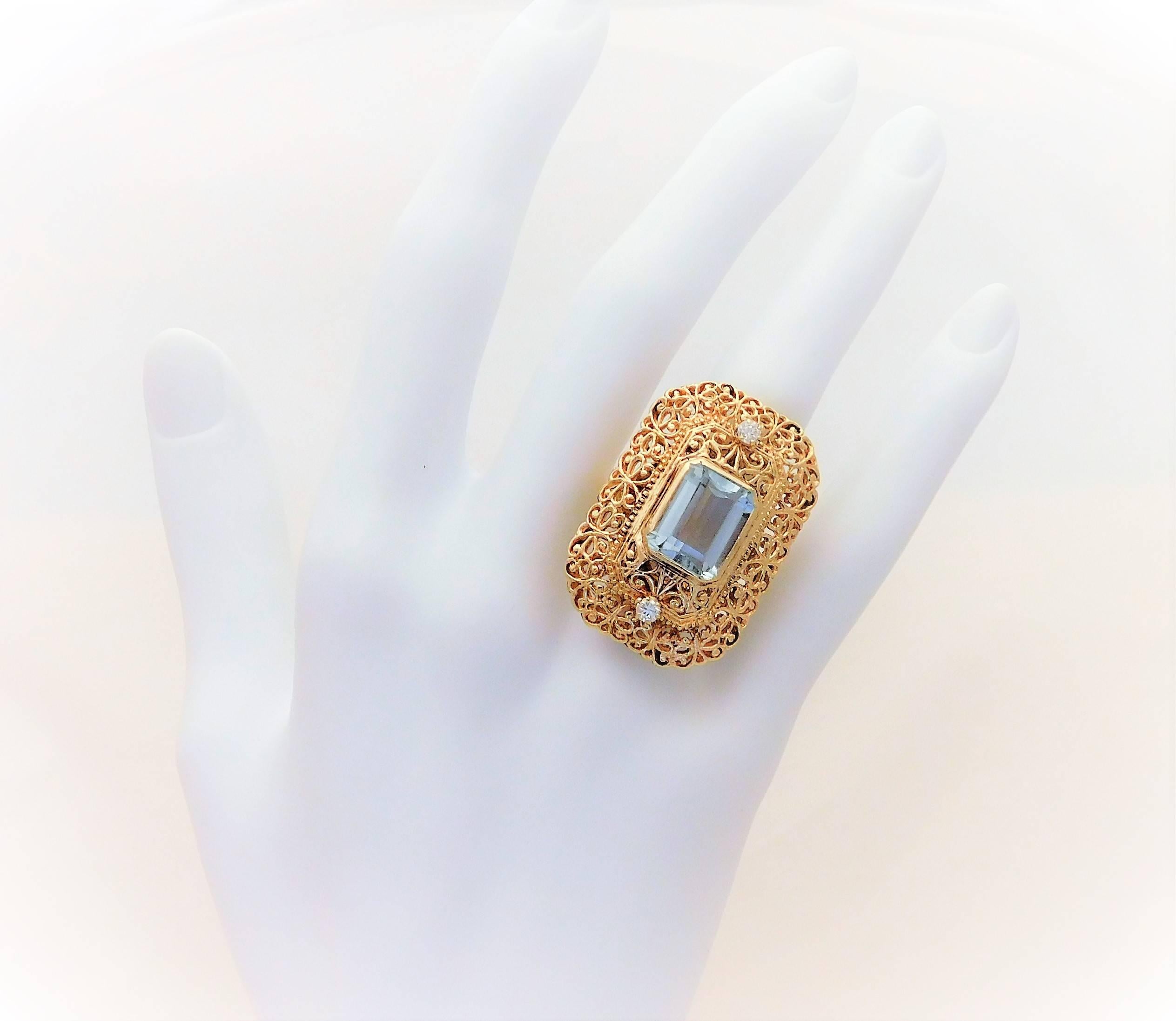 
From a Southern aristocratic estate.  Circa Mid 20th Century.  This breathtaking big statement-style ring has been meticulously crafted in solid 14k yellow gold.  It is masterfully jeweled with two G/H color natural round brilliant-cut diamonds