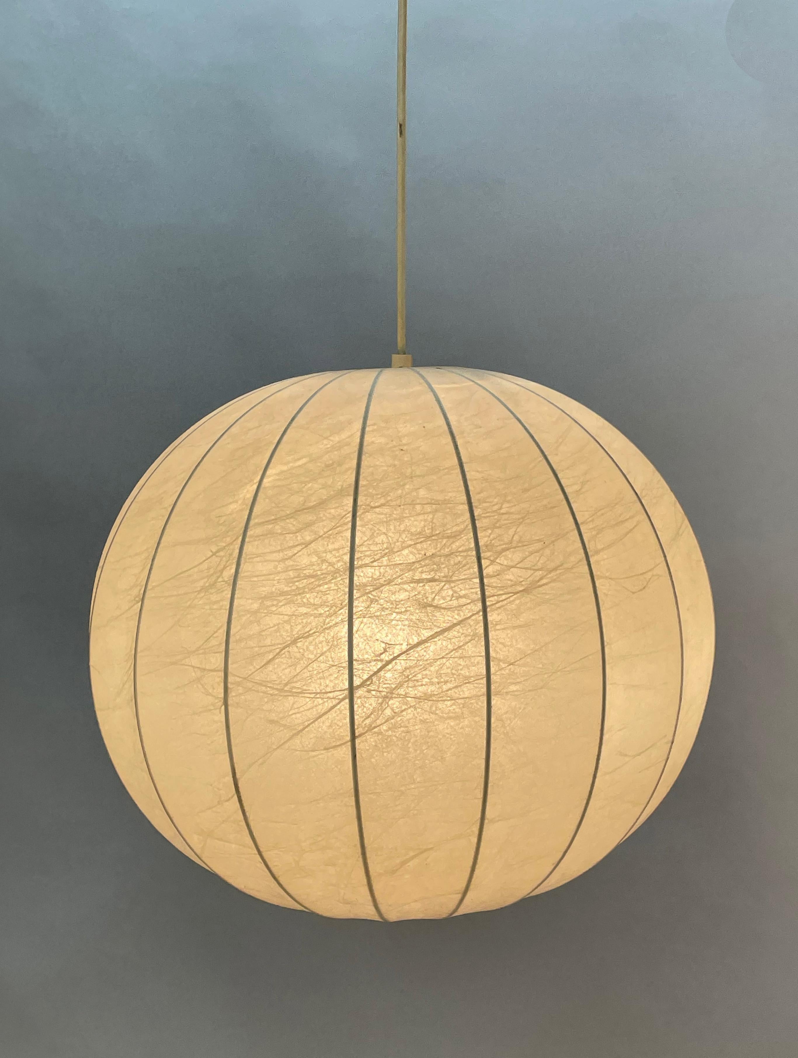 Incredible mid-century resin and metal 'Cocoon' chandelier. The metal structure is colored in yellow, red, green and blue. This wonderful pendant lamp was designed by Achille Castiglioni in Italy in the 1960s.

This fantastic piece features a