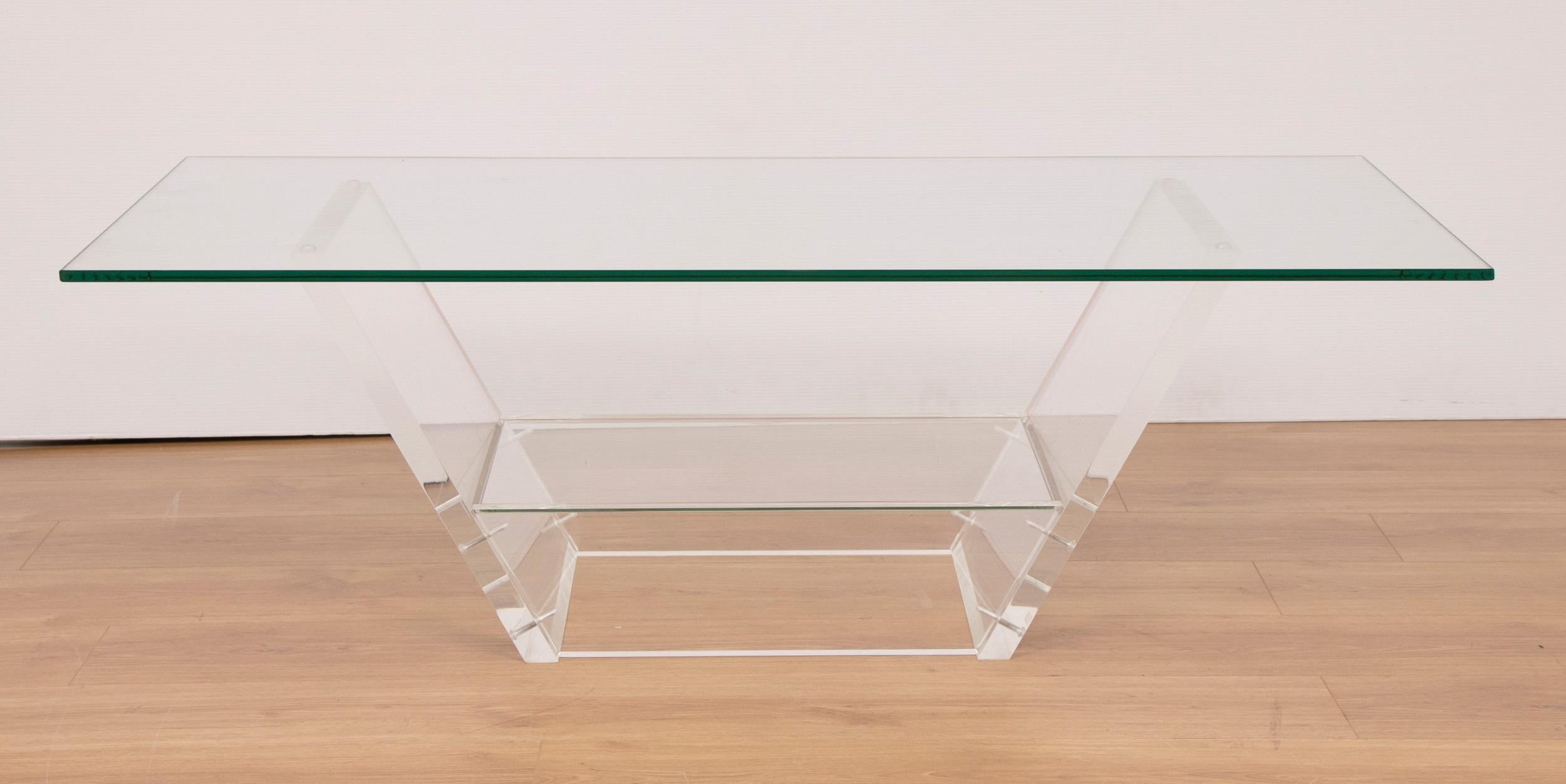 Midcentury streamline table in acrylic and glass
Designed by David Lange for the Metz Department Store, Amsterdam
Measures: H 36cm, W 115cm, D 64cm
French, circa 1972
Designer label attached.