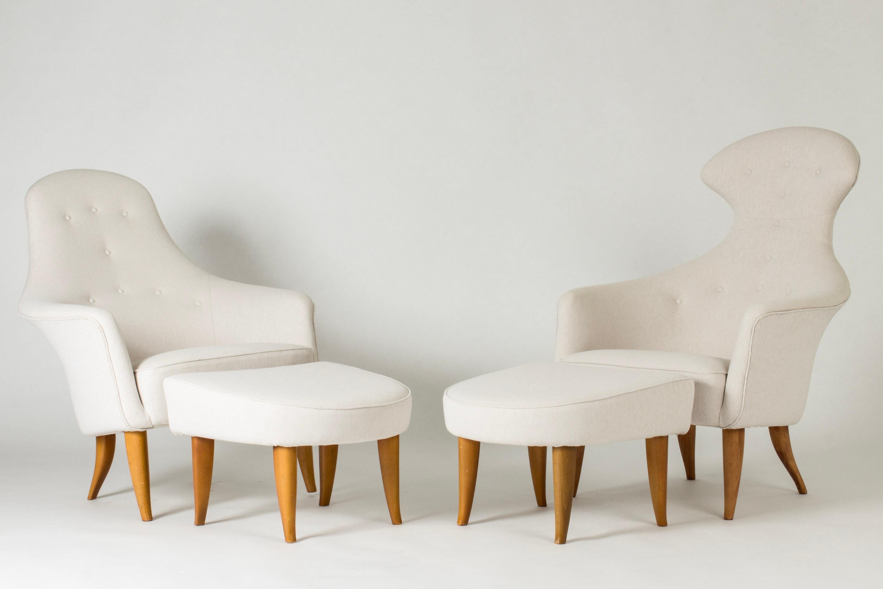 Stunning pair of “Big Adam” (“Stora Adam”) and “Big Eve” (“Stora Eva”) lounge chairs with footstools by Kerstin Hörlin-Holmquist, from the “Paradis” series. Upholstered with crisp white linen fabric. 

The “Paradis” series was introduced in 1958 as