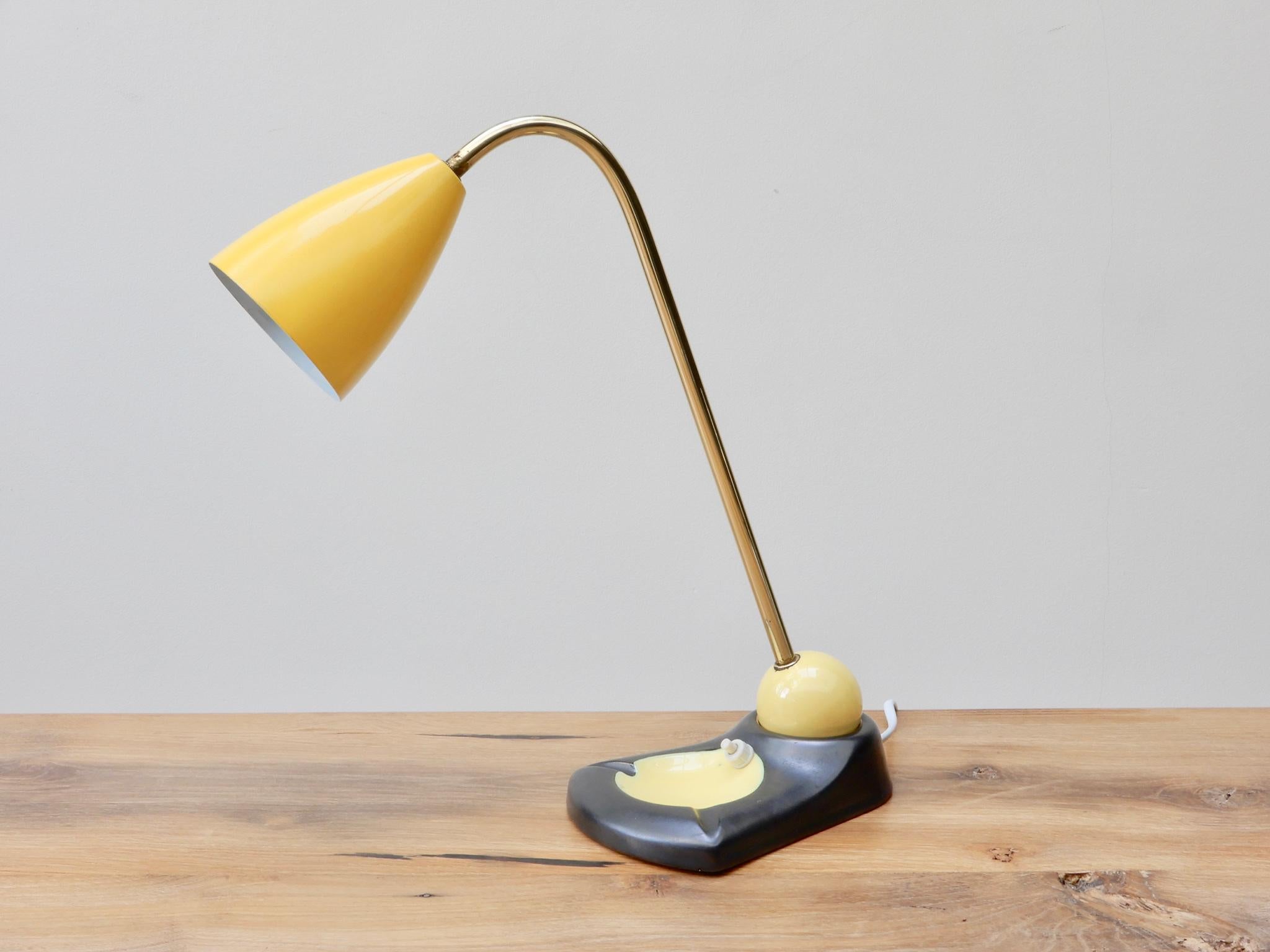 Midcentury adjustable brass table lamp / vide poche or ashtray with a yellow lacquered metal shade.