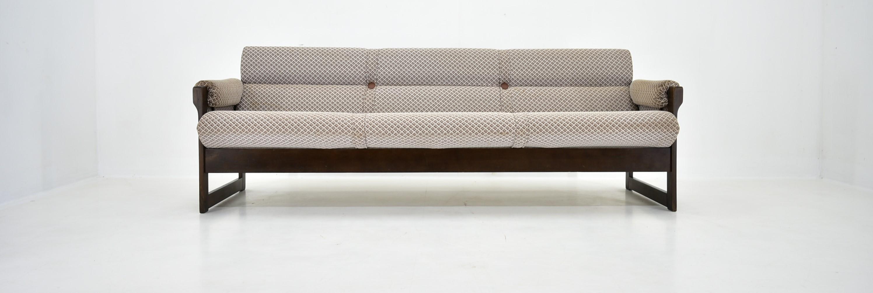 This sofa was made in the 1970s by Hikor Písek company in the former Czechoslovakia. It´s made of oak and fabric. It´s in good Vintage condition- Made in Czechoslovakia.When the sofa is unfolded, the width is 98 cm. The seat is 46 m high.