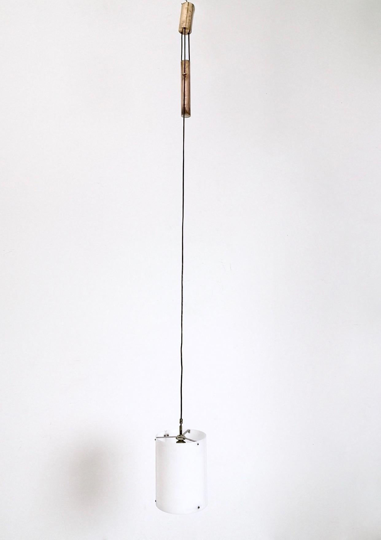 Italy, 1954.
Made in plexiglass and brass. 
This pendant features its original patina, but on request we can polish the brass. 
It is a vintage item, therefore it might show slight traces of use, but it can be considered as in excellent original
