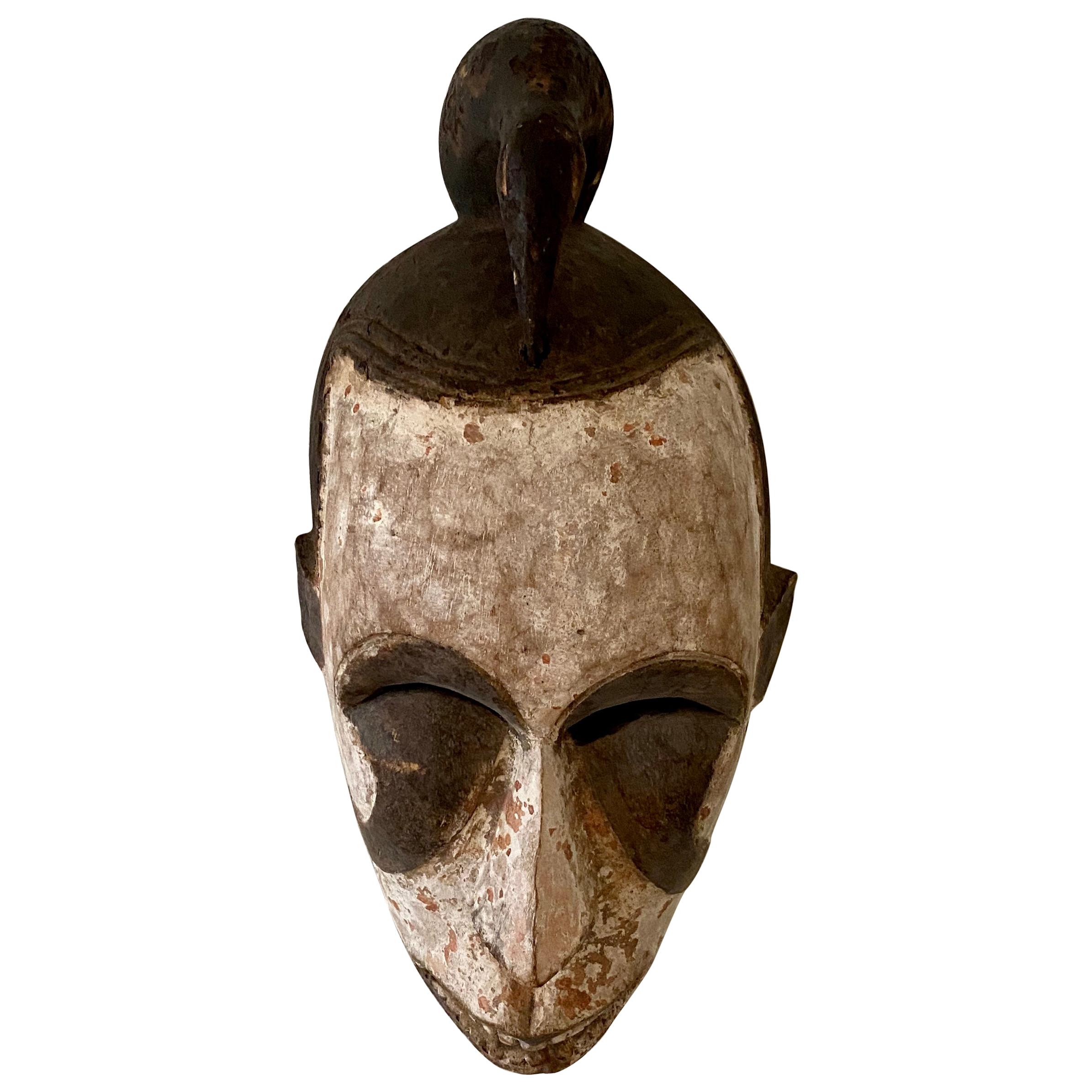 Midcentury African Kpelie Mask Senufo Tribe Ivory Cost with a Calao Bird, 1950