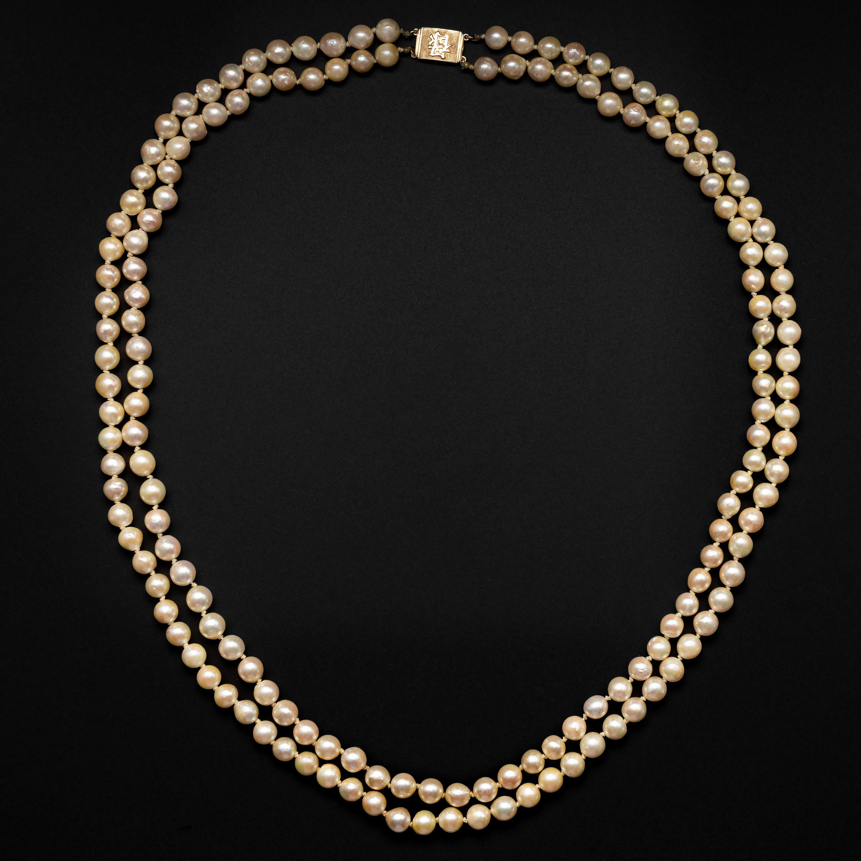 Dating from the late 1950s, this double-strand cultured Akoya pearl necklace was created by the iconic Hawaii-based jeweler, Ming's. The firm was known their their unique aesthetic and use of high-quality materials including natural, untreated