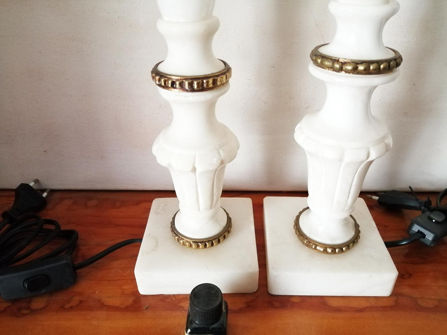 New wiring
Large table lamps in pure white natural alabaster or marble and bronze.
They are large in size, suitable to place on a side table in the living room or on a nightstand

It is in great condition. like new
Never used, .
Beautiful pair of 