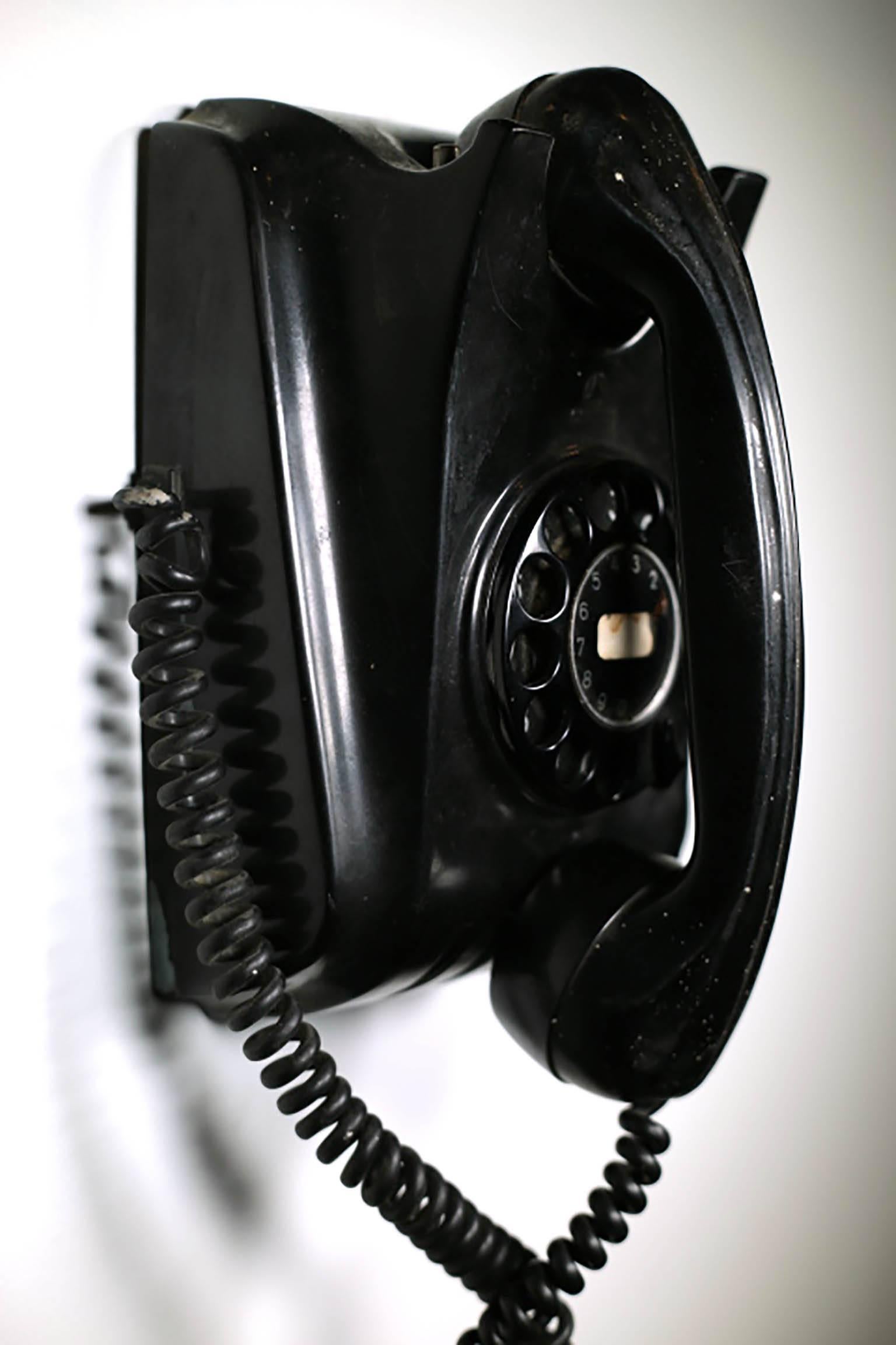 All bakelite telephone from The Netherlands, circa 1950s. The dial works properly. The phone might work if hooked up.