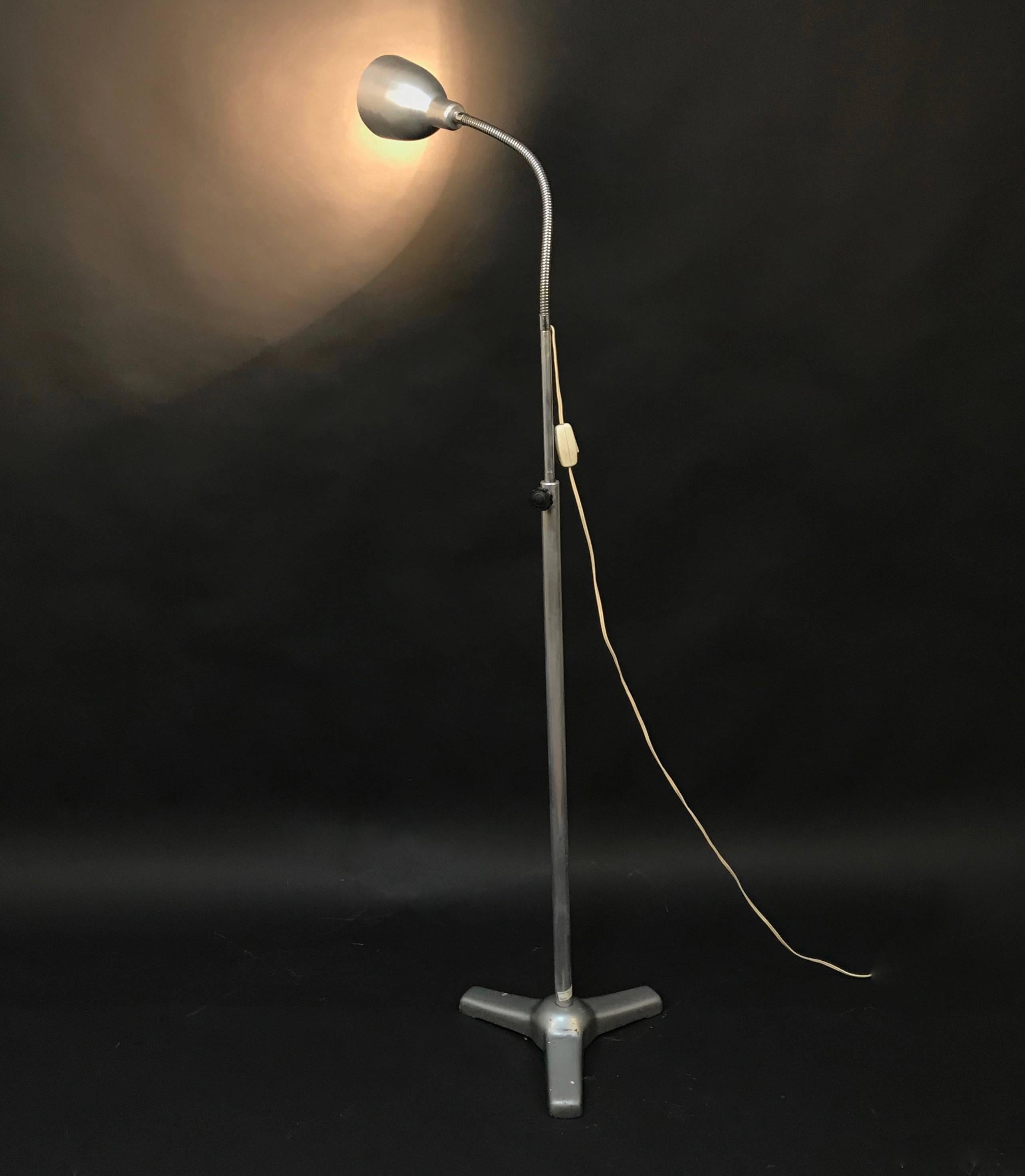 A magnificent piece of industrial medical design, this iron and aluminium floor lamp was used for having a clear view when visiting patients during the 50s.

An Italian example of fine and useful design, testified by the tripod base and the