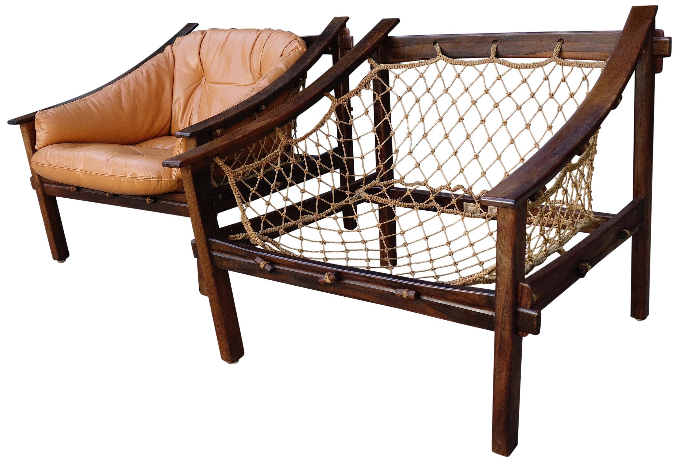 Pure Brazilian midcentury design. Featuring a solid Brazilian rosewood frame and netted rope inspired by local fisherman. These lounge chairs have a sleek design that look spectacular from any angle. This rare set is in original condition with the