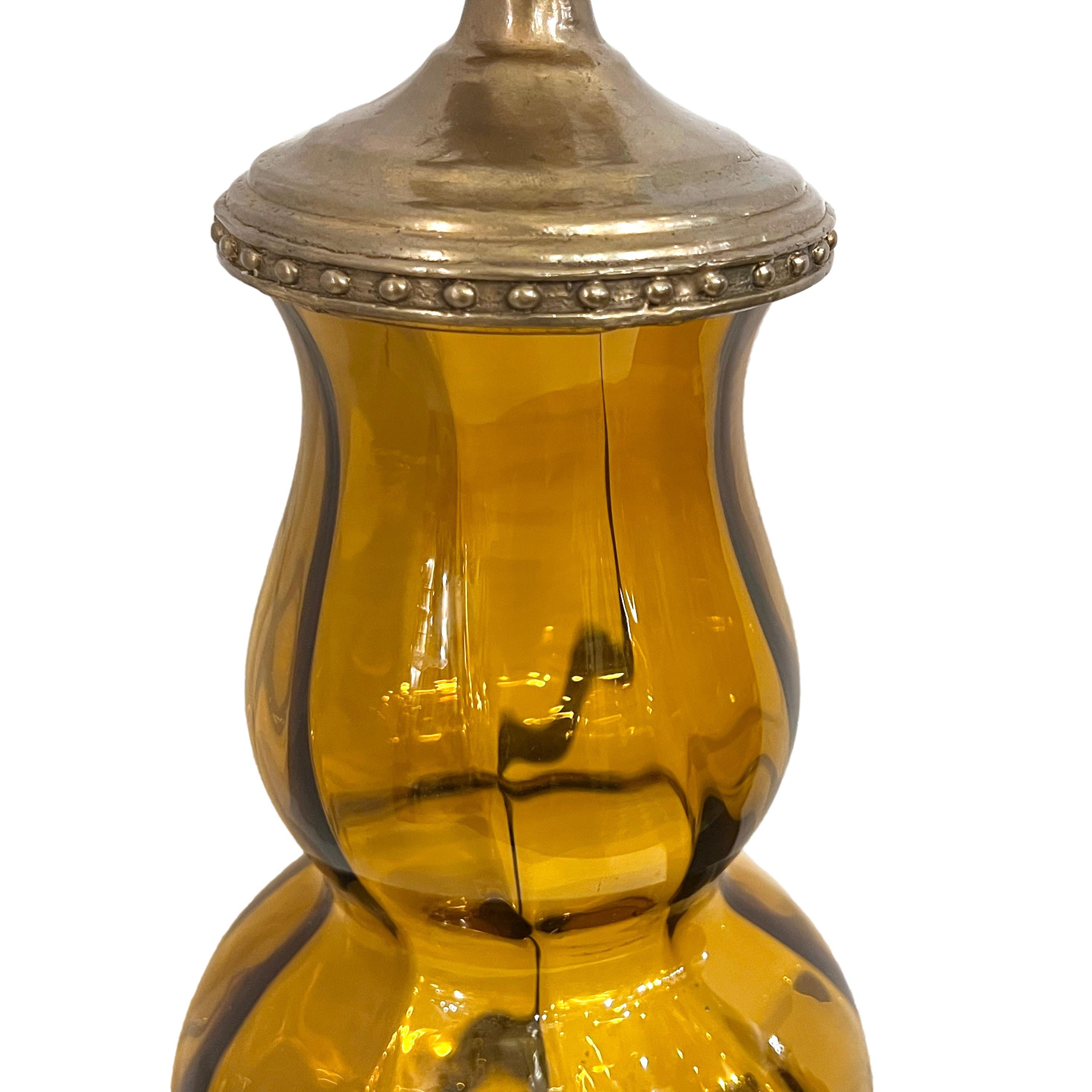 An Italian circa 1960s amber glass table lamp.

Measurements:
Height of body: 18.5