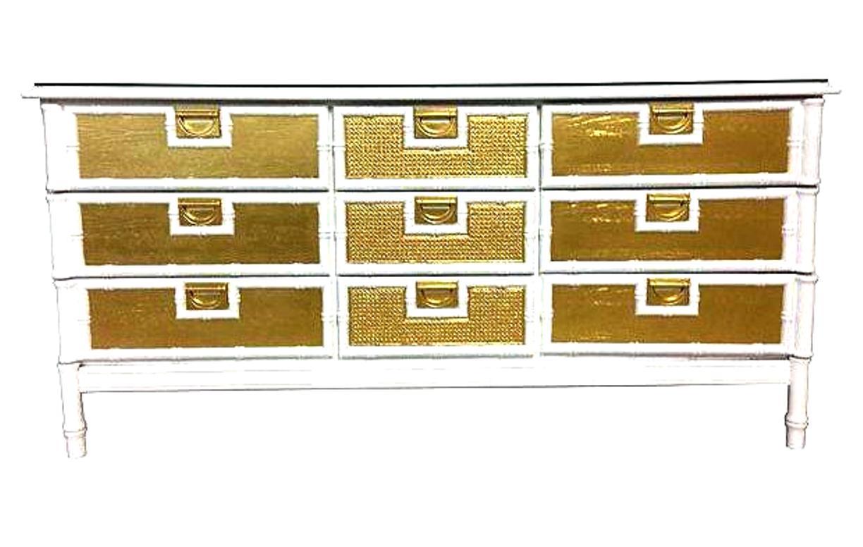 Mid-20th Century American Campaign Style wood and gilt brass faux bamboo white and gold lacquered credenza with new glass top. This approximately 5.5