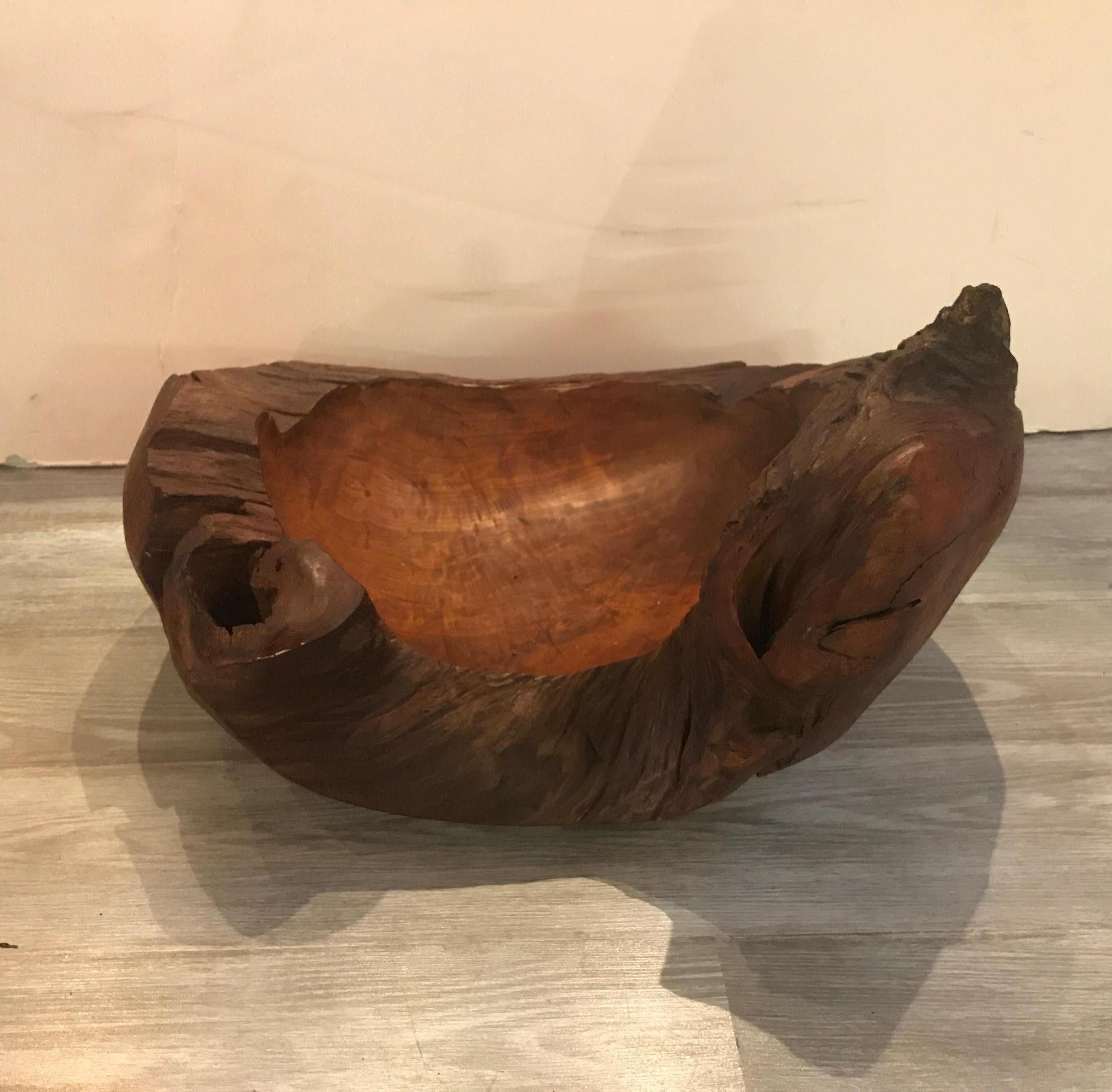 Unusual and highly figurative hand-carved artisan bowl, mid-20th century, American. This one of a kind hand carved bowl is made from a single large piece of wood. Very earthy and organic.
