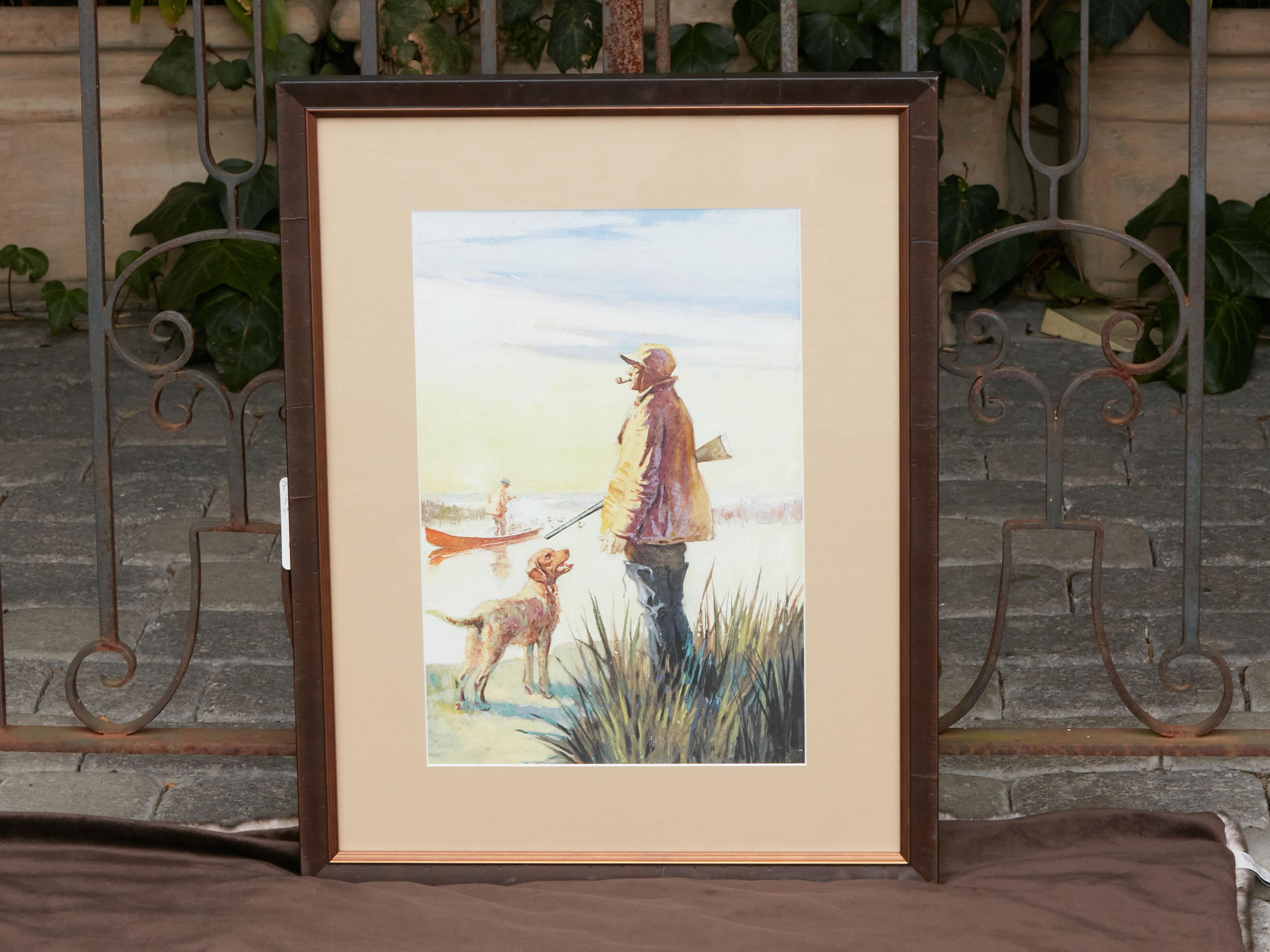 An American framed watercolor from the mid 20th century depicting a hunting scene. Made in the USA during the Midcentury period, this watercolor features a scene depicted at sunrise. A pipe-smoking hunter, holding a rifle in his right arm and