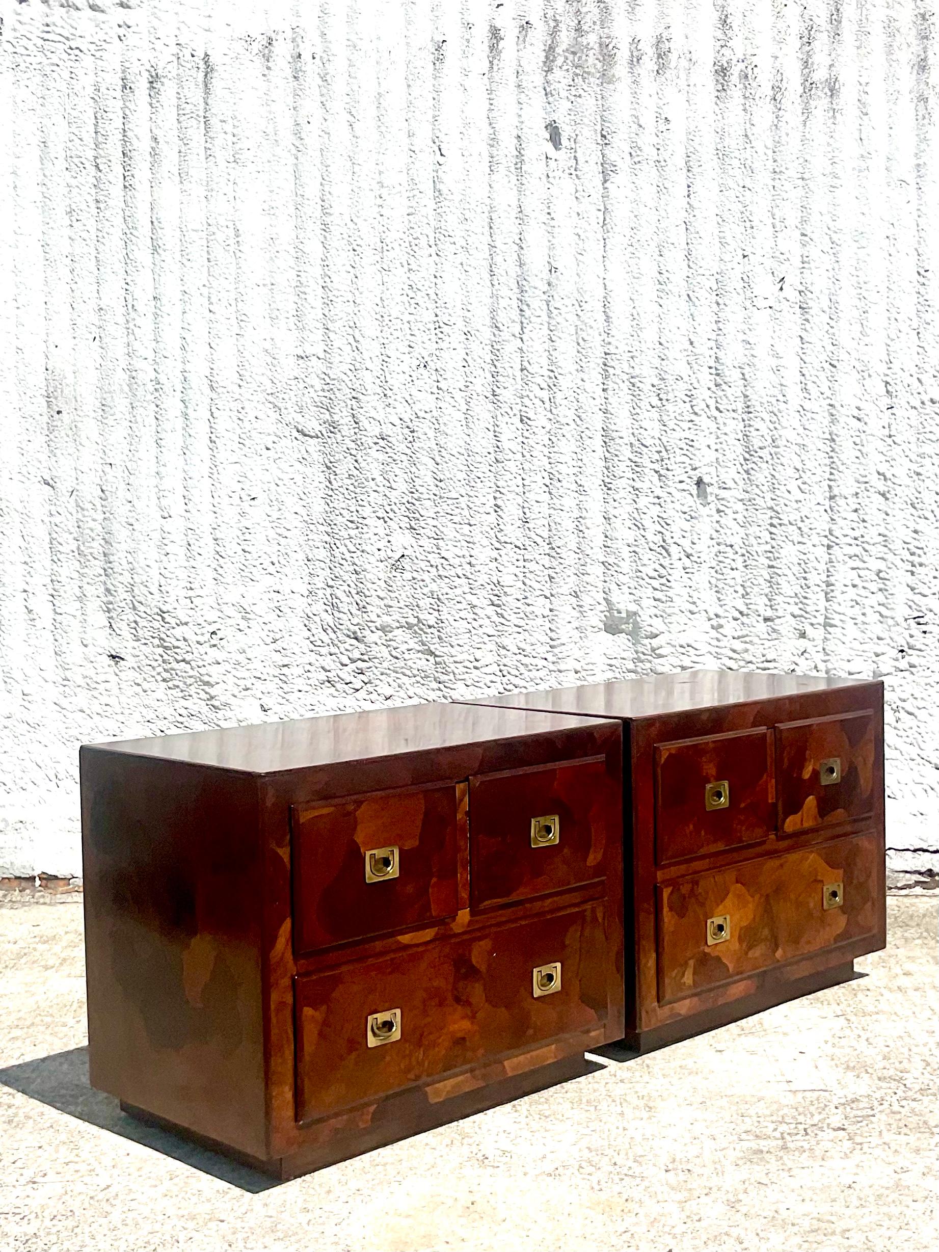 Incredible vintage pair of Midcentury nightstands. Made by the iconic American Of Martinsville. Made from a patchwork of different shades of Olive wood. Acquired from a Palm Beach estate.