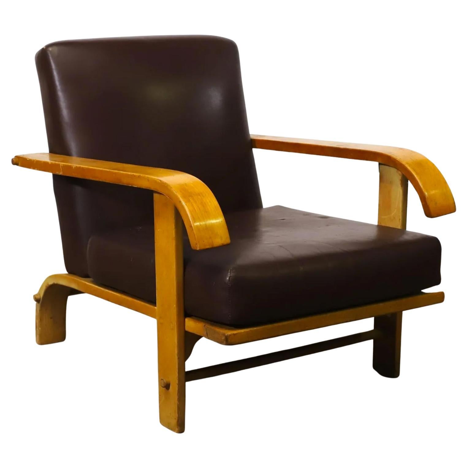Rare original mid-century Russel Wright for Conant Ball. All maple low lounge chair. Arms have unique downward curve - great Design. Solid Maple frames with curved back legs and all original dark brown leather upholstery. Original vintage condition