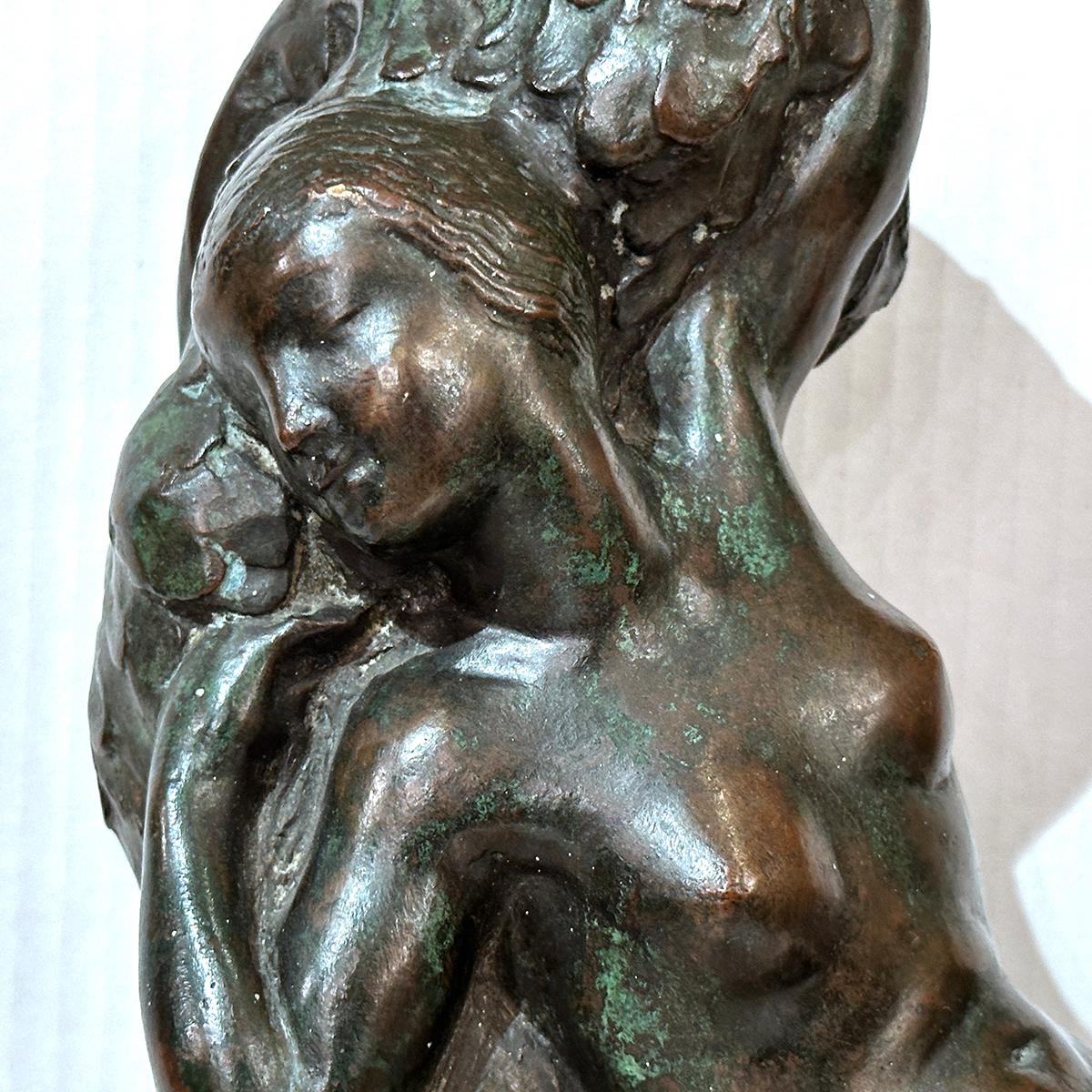 Circa 1940's American patinated bronze statue of a woman with original patina.

Measurements:
Length: 11