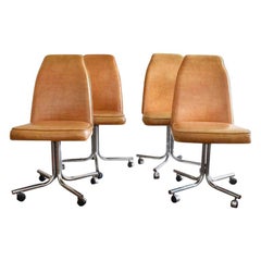 Midcentury and Chrome Rolling Brown Bucket Chairs Set of Four