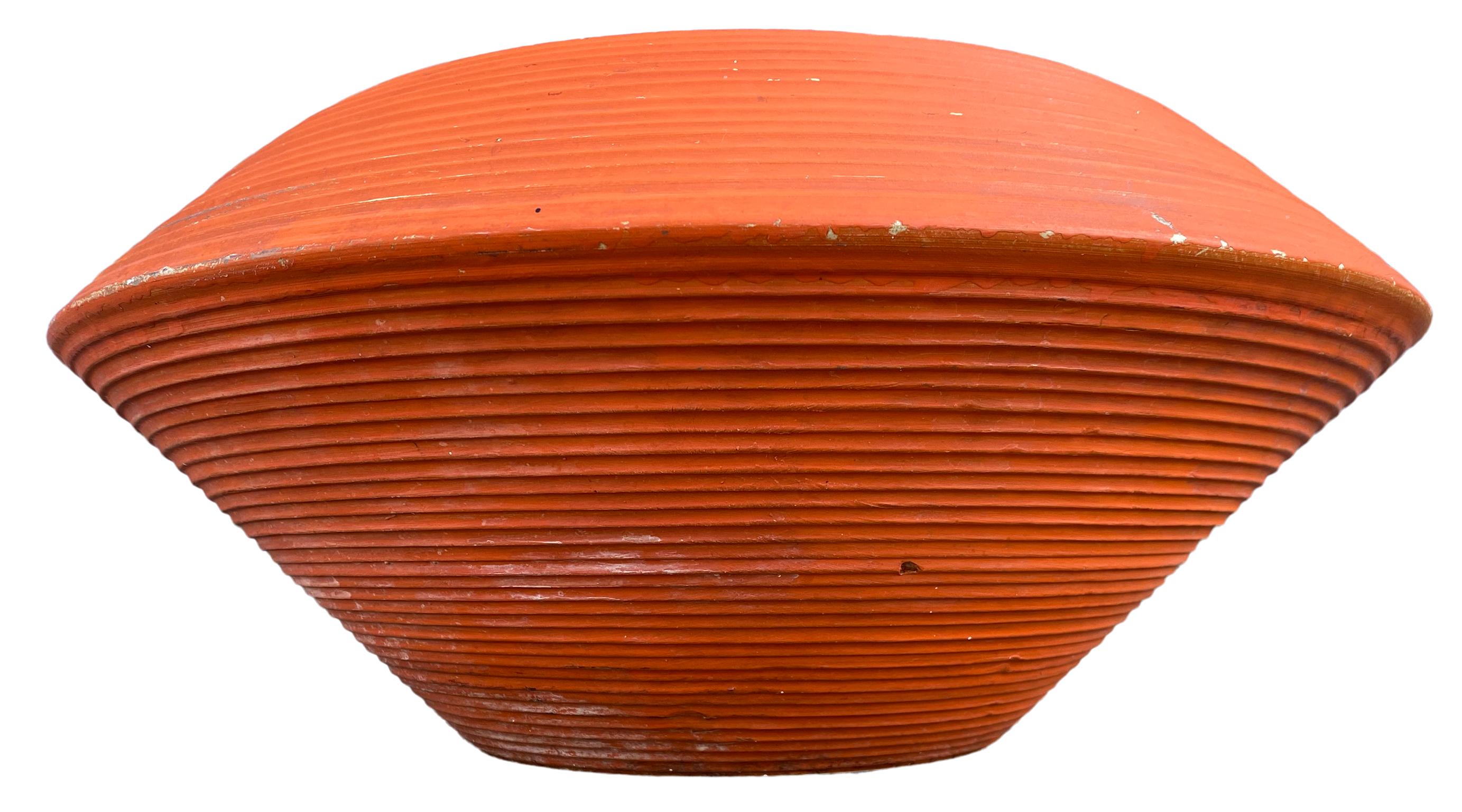 Iconic American Mid-Century Modern Zanesville architectural pottery planter pot. Zanesville pottery Stoneage modern collection, circa 1960s. Simple architectural UFO shape is given great visual interest with incised surface treatment and rich orange