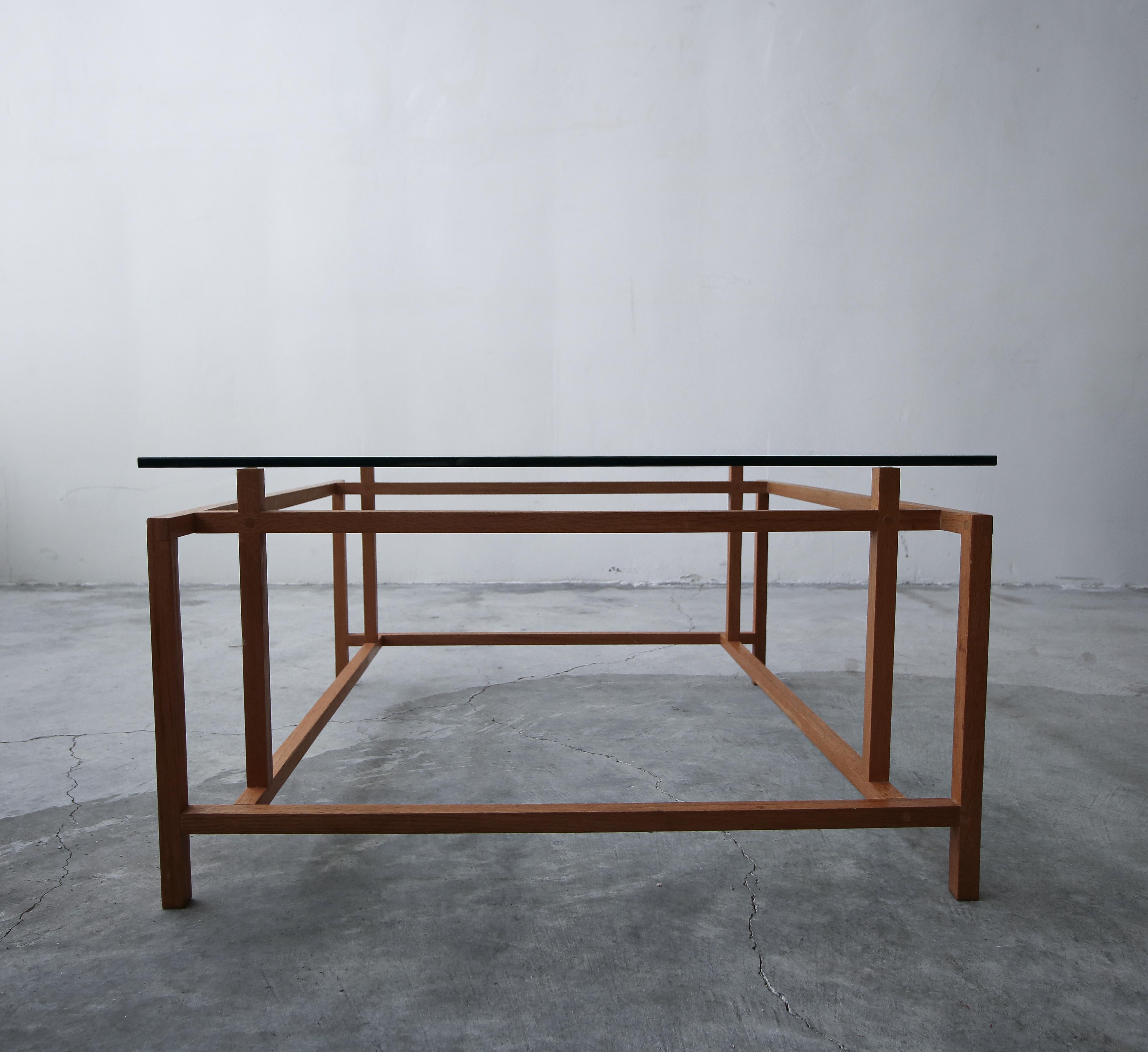 Midcentury Danish teak coffee table by Henning Norgaard for Komfort. A very simple yet beautiful table with a very architectural appearance.

The table is in excellent condition overall. Glass has minor scratches from age and use but overall there