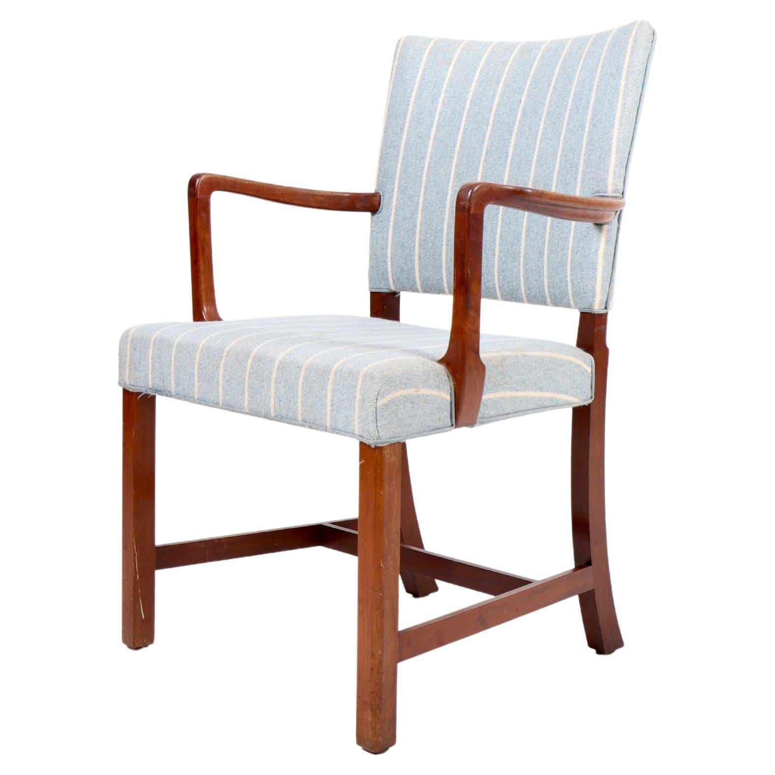 Arm chair in solid teak and fabric designed by Maa. Ole Wanscher and made by AJ Iversen cabinet makers Copenhagen.