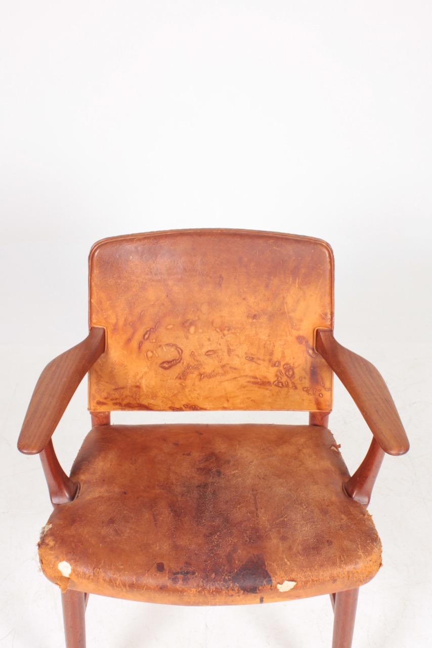 Scandinavian Modern Midcentury Armchair in Teak and Patinated Leather, Danish Cabinetmaker 1950s