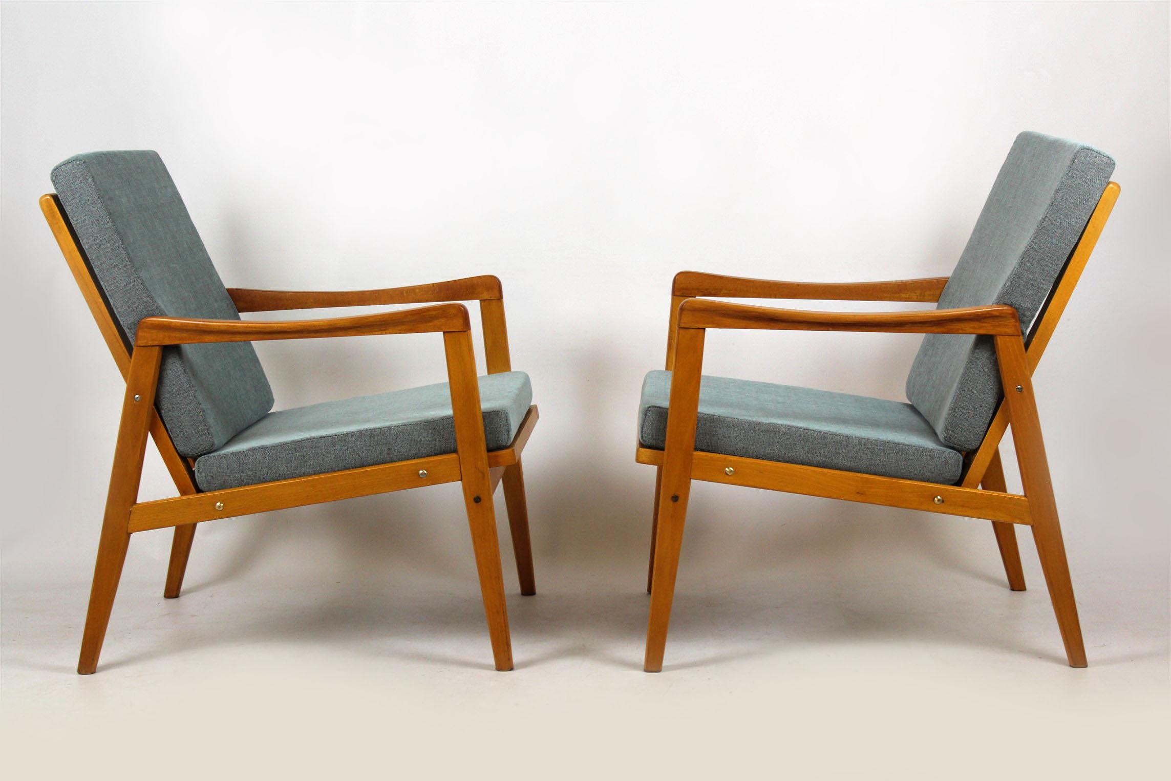 A pair of armchairs from the mid-1960s, made in former Czechoslovakia. 
New pillows upholstered with new fabric. Woodwork kept in original, good condition.