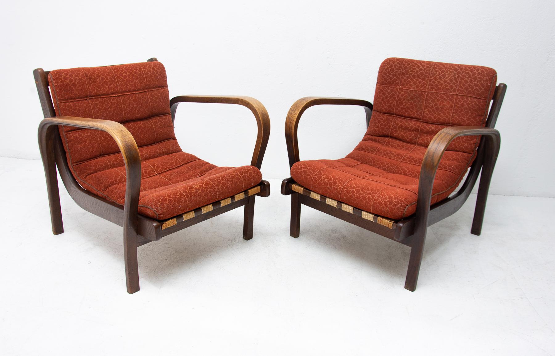A pair of midcentury armchairs designed by Kropacek and Kozelka, manufactured in the former Czechoslovakia for Interior Praha. These armchairs received a silver medal at the 1946 Milan Triennale. The armchairs are in very good condition, feature a