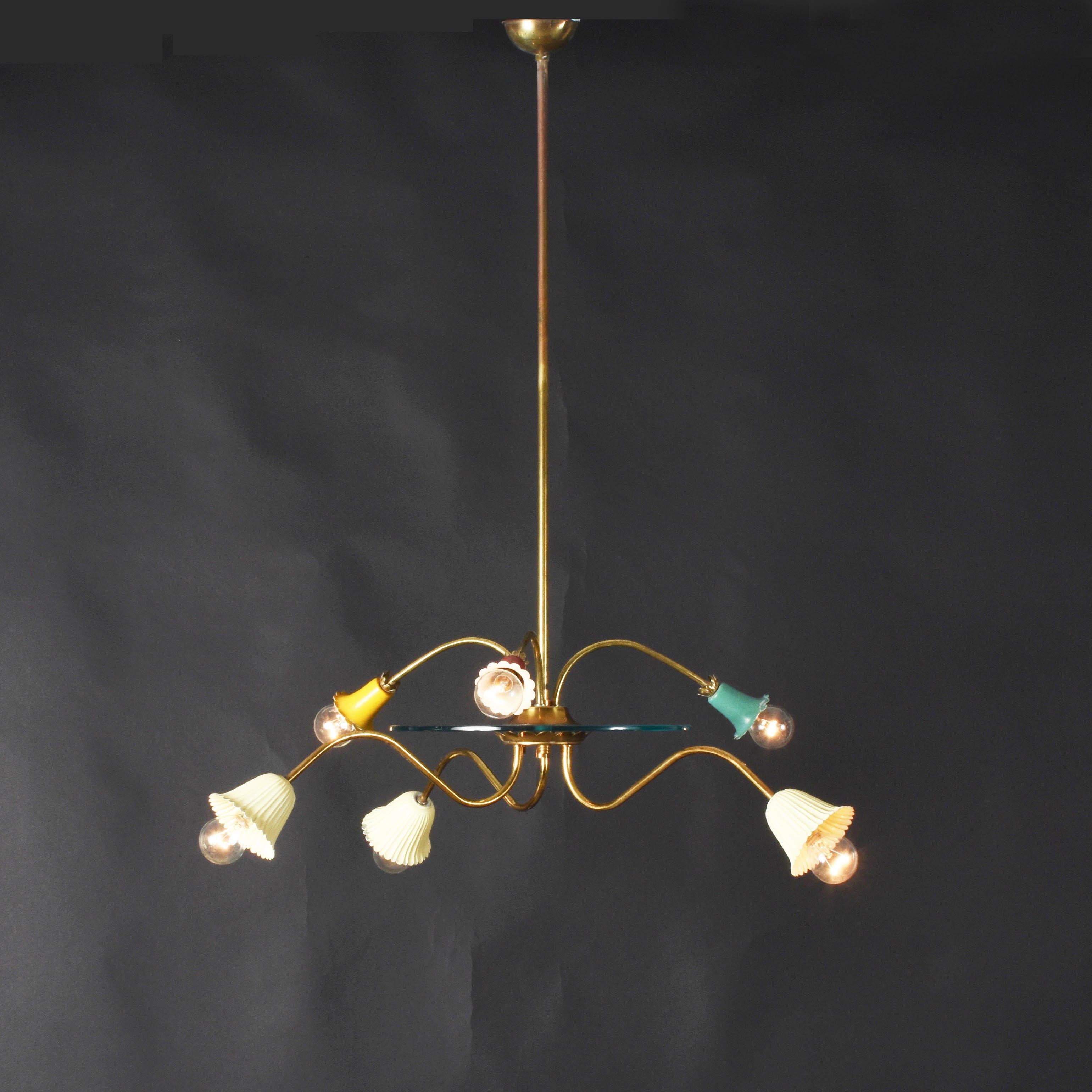Wonderful Italian chandelier, produced during the 1950s attributed to Arredoluce.

Multicolored bell shades in Italian enameled brass with six lights. A glass base is separating the first floor of bulbs from the second one.

A great and