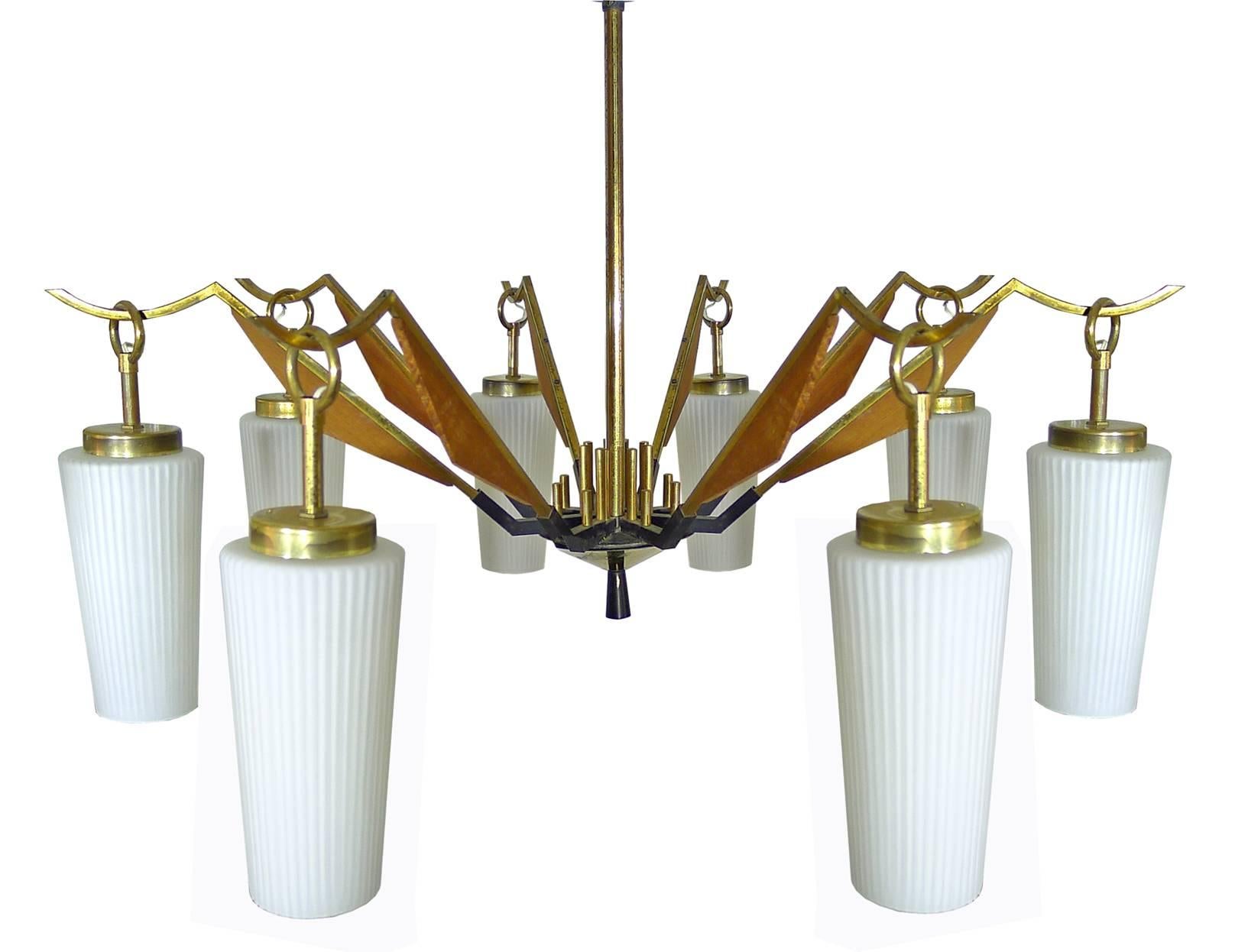 Large vintage Mid-Century Modern Stilnovo style brass and teak wood spider chandelier with Eight hanging arms glass shades in the Danish style. Age patina.
Measures:
Diameter: 30 in/ 76 cm
Height: 40 in / 100 cm
Weight 11 lb. (5 kg).
Eight-light