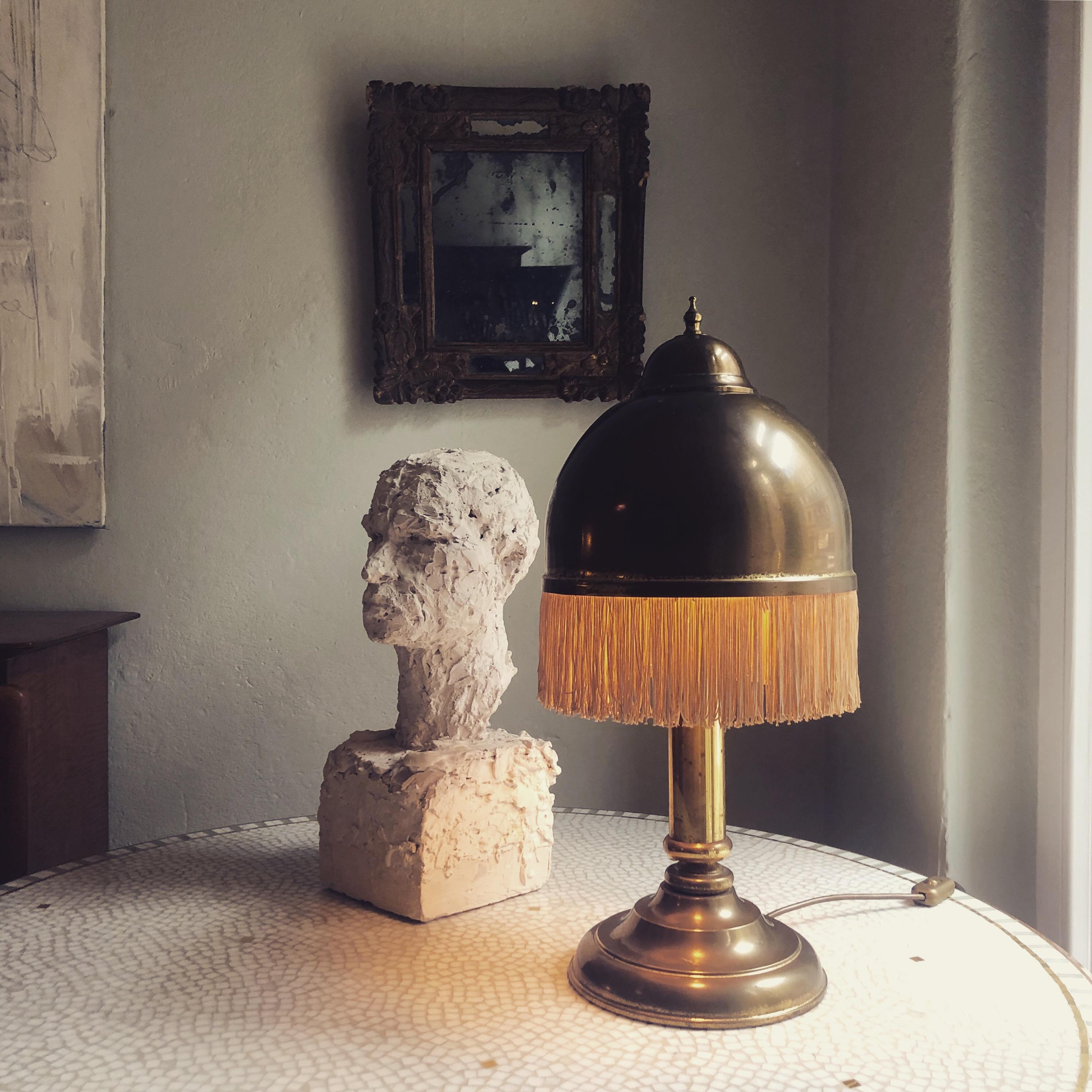 This beautiful brass table lamp is produced in the Style of Hans-Agne Jakobsson, circa 1960.
The silk fringes give the lamp a very special and elegant look.
It could be also done in the 1920 as it has this Art Deco style.
A great eyecatcher for your