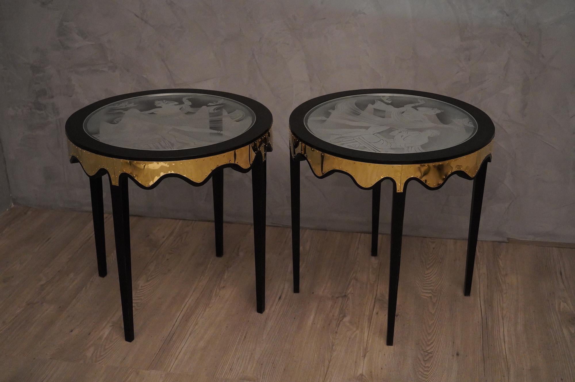 Wonderful of side tables in the Italian style of Fontana Arte; valuable choice of materials, a unique design. Glass with sandblasted design in the style of Gio Ponti.

Lovely round side tables all in beech wood polished with black shellac. The top