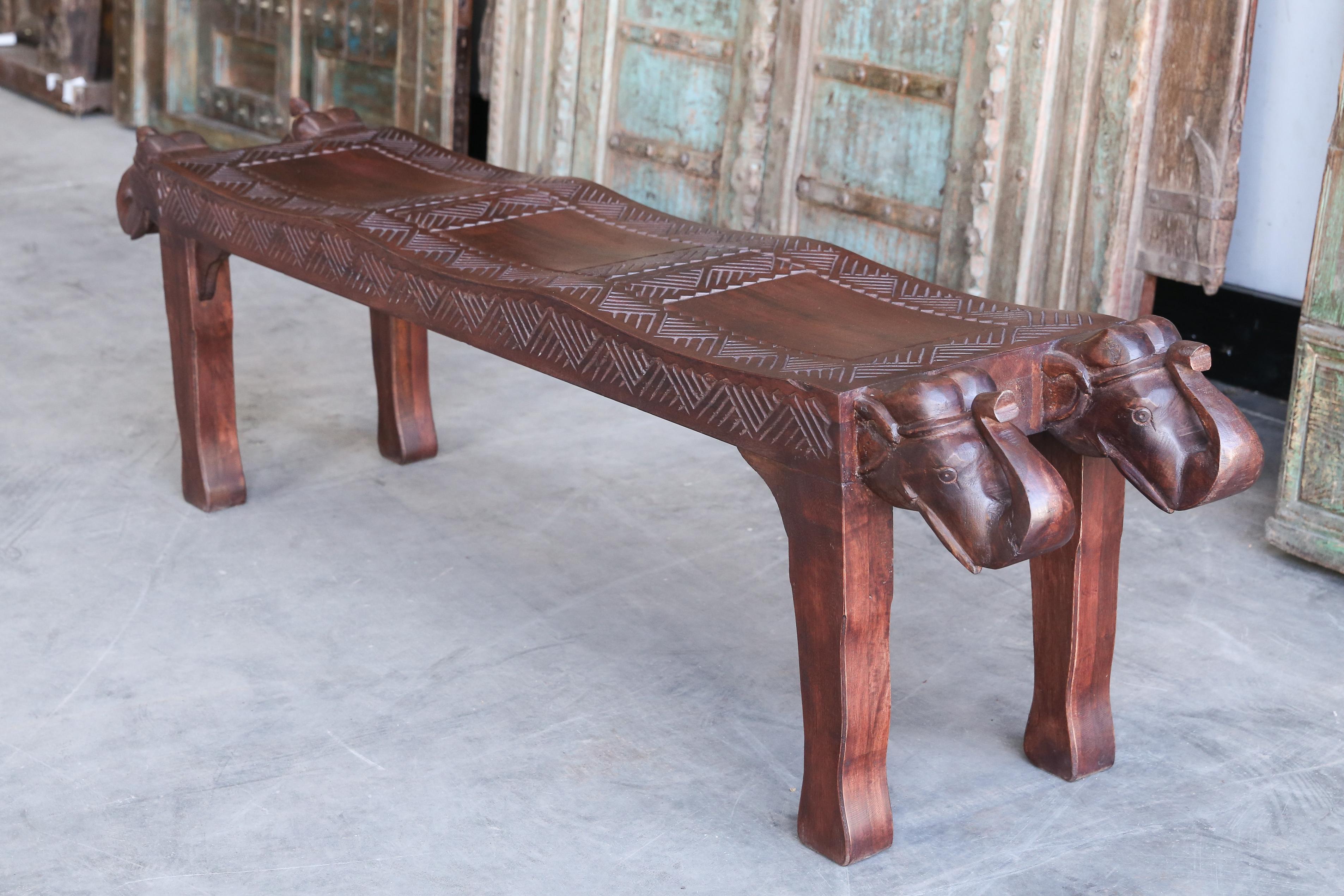 This is handcrafted in solid teak wood for a village headman. The seat is hand carved and is more than 3 inches thick all through. Heavily made to last centuries. Two carved elephant heads at both ends indicates the place is near jungles inhabited