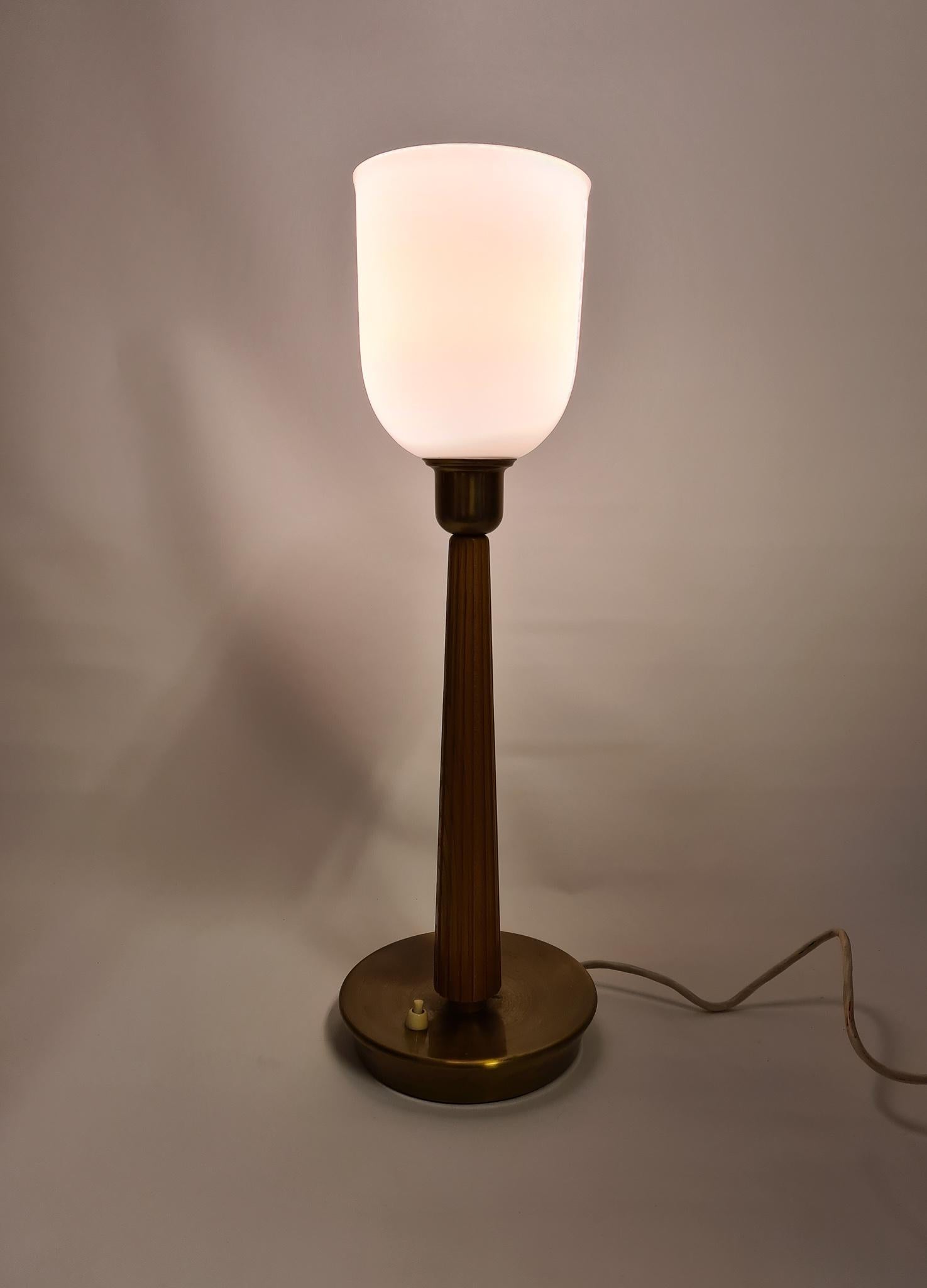 Genuinely nice Swedish table lamp made in 1940 for ASEA and designed by Hans Bergström. Brass with wood and opaline glass in a nice combination. 

Good condition with some wear consistent with age and use

Measurements: H 54 cm with opaline