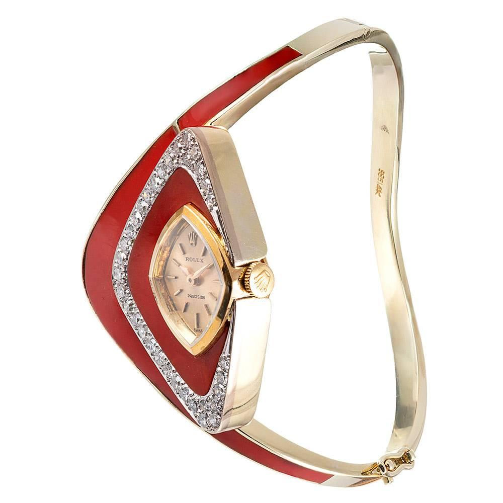 An exceptional find for the vintage Rolex enthusiast or the lover of unique and beautiful objects, this absolutely striking asymmetric bracelet cleverly houses a manually-wound Rolex watch in its artful gemstone frame. The design is centered upon