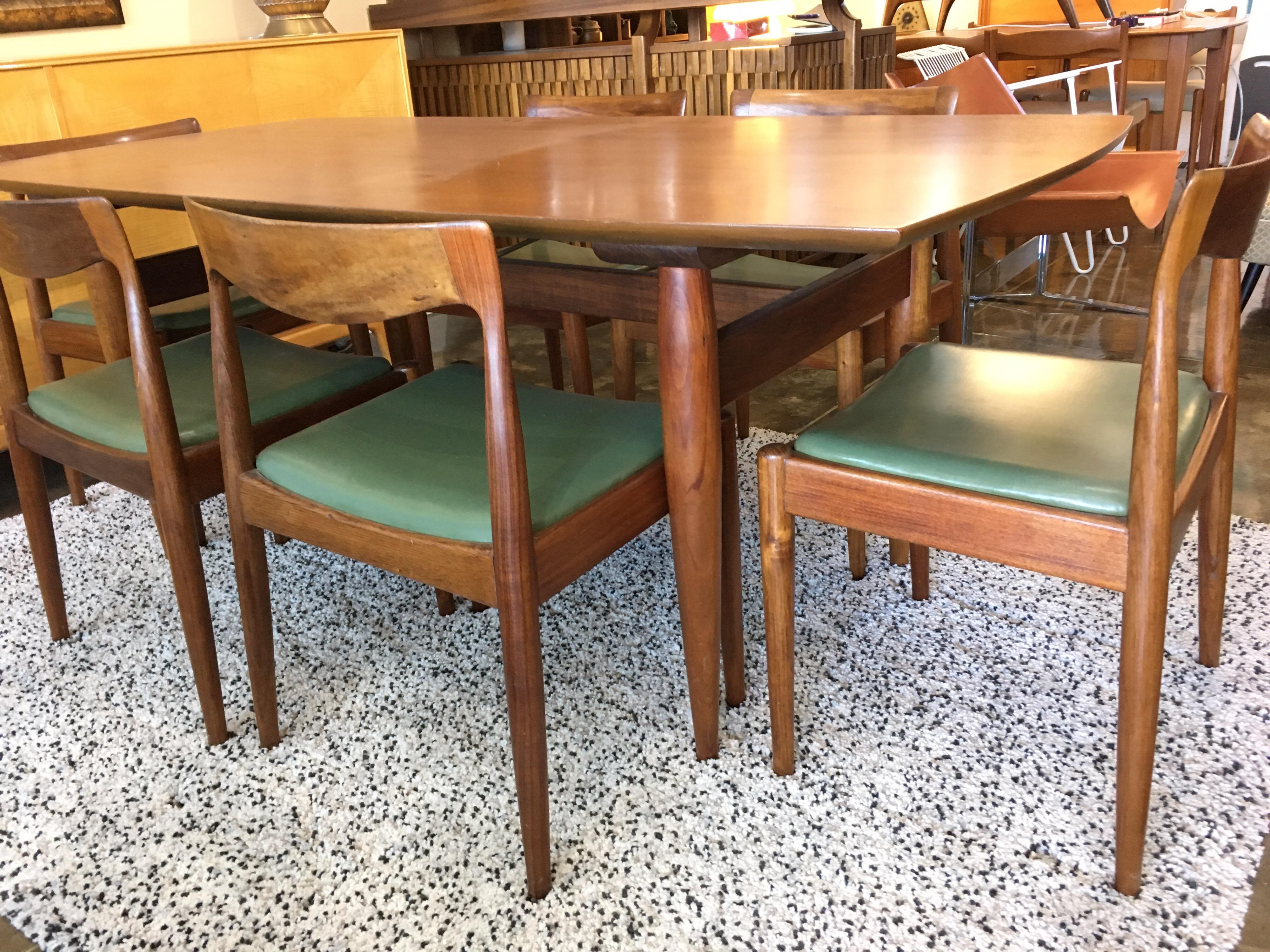 Midcentury Australian blackwood dining Suite by Danish Deluxe, circa 1960s. In exceptional original condition, comprising nicely tapered dining table and six chairs. This is the finest example of this suite available.

Table measures: 180 cm L x