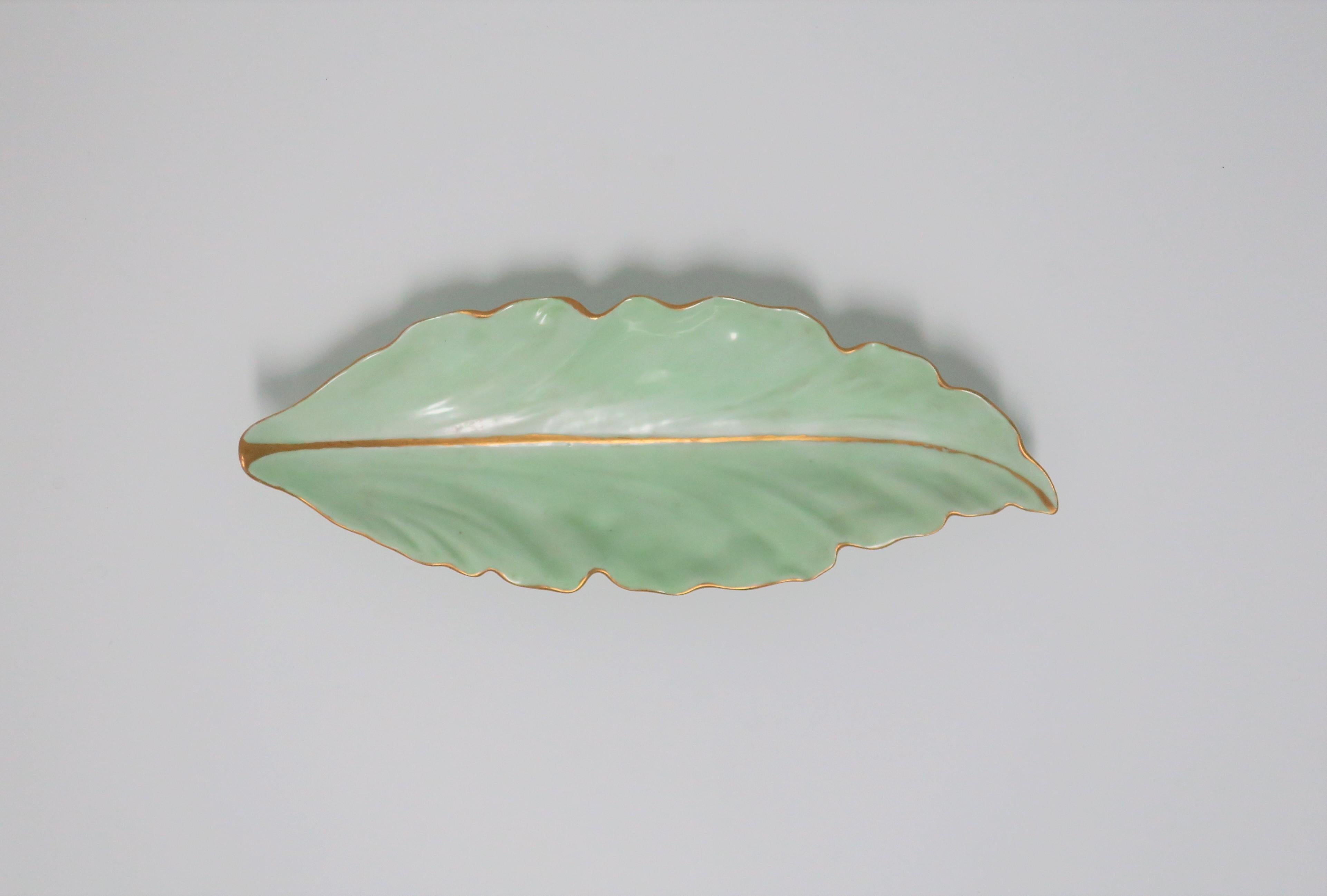 A beautiful European oblong light green porcelain leaf dish with hand painted gold accent, circa mid-20th century, Vienna, Austria. With maker's mark on bottom (images #10 and 11.)

Piece measures: 2.25