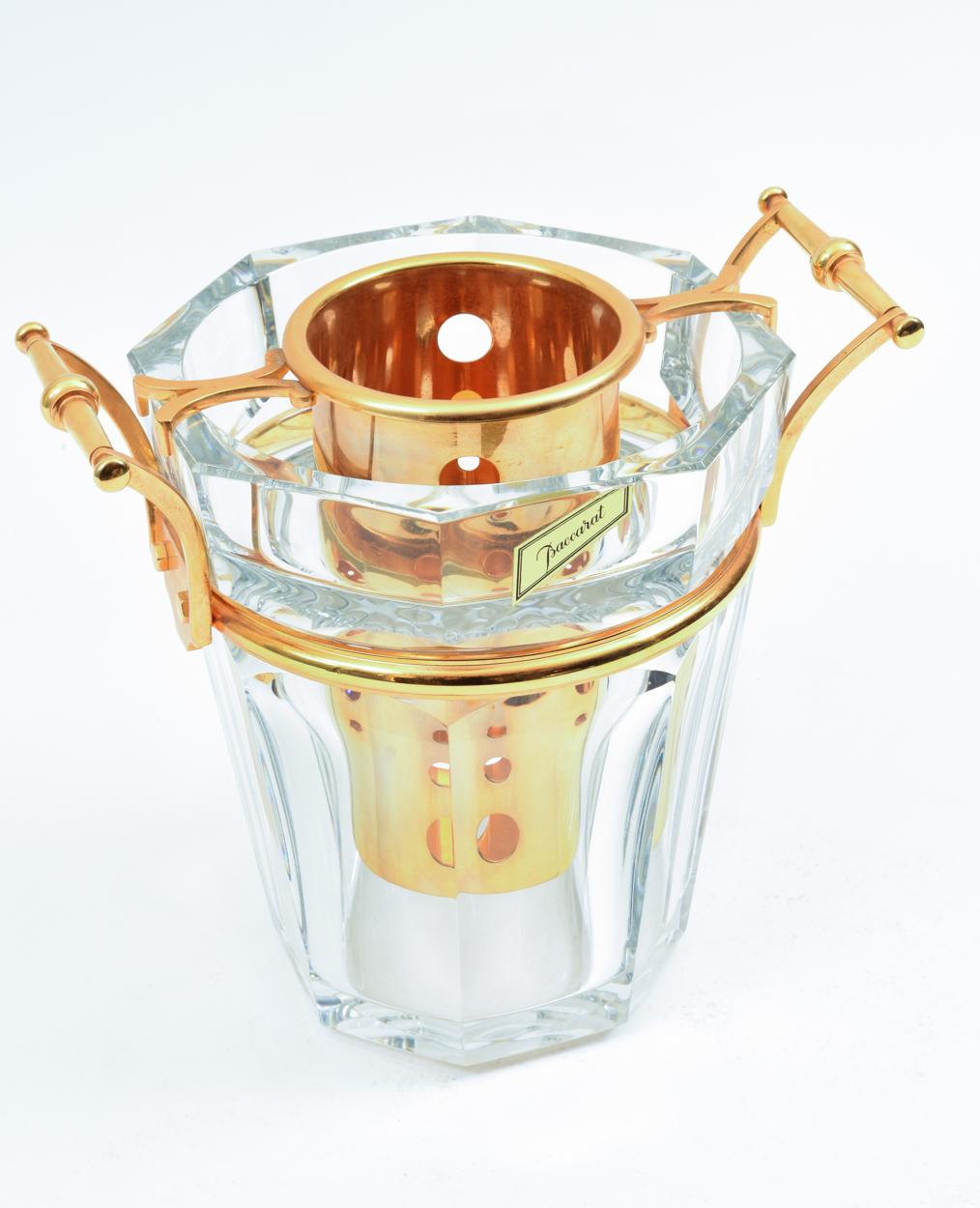 Beautiful Baccarat crystal Champagne / wine cooler bucket, with gilded bronze mounted fittings bottle holder and sides handle. The cooler is in excellent condition. Maker's mark undersigned on each piece. The cooler stand about 10.5 inches diameter