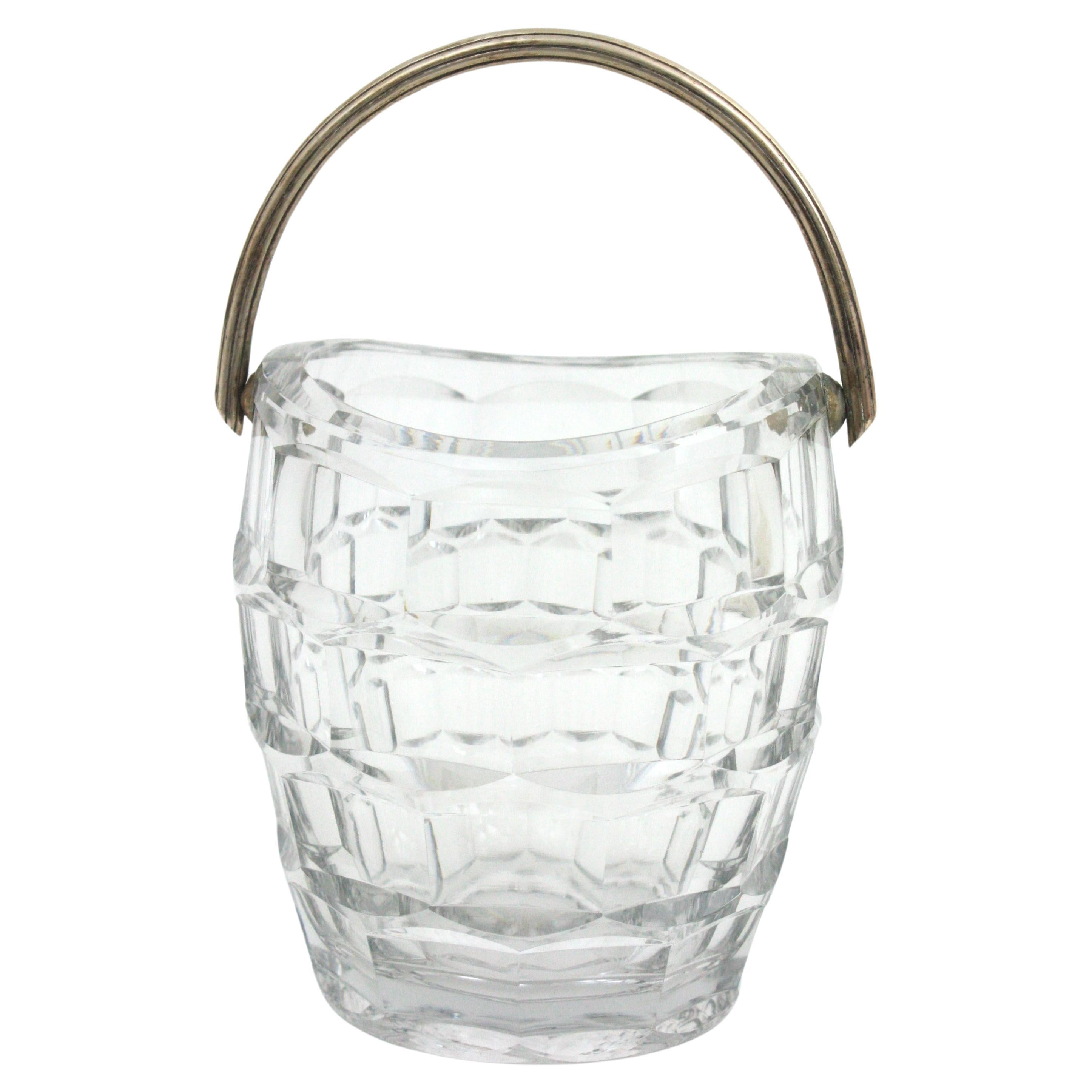 Baccarat Crystal and Sterling Silver Ice Bucket with single handle, France, 1950s
This ice bucket is comprised by a cut crystal container with sterling silver striped handle.
This sexy ice bucket will be a nice addition to your dinning table,